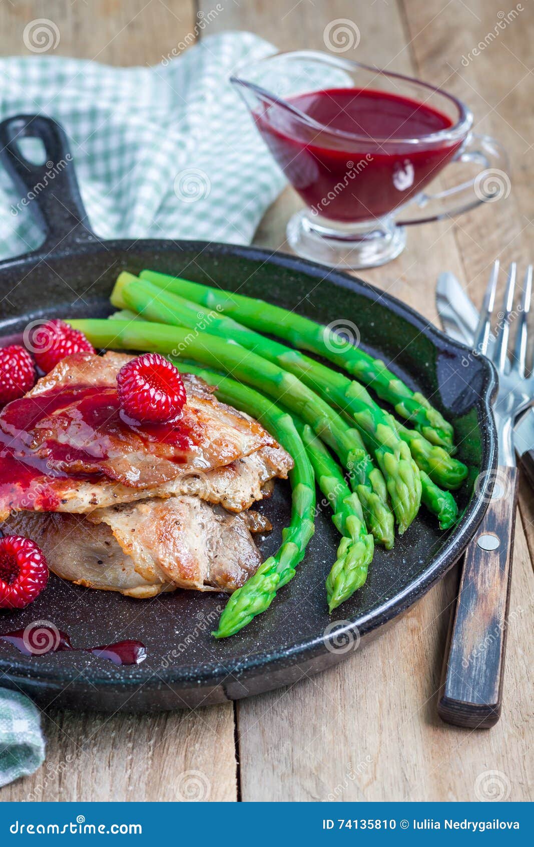 Pork Cutlets with Raspberry Sauce and Asparagus, Vertical Stock Photo ...