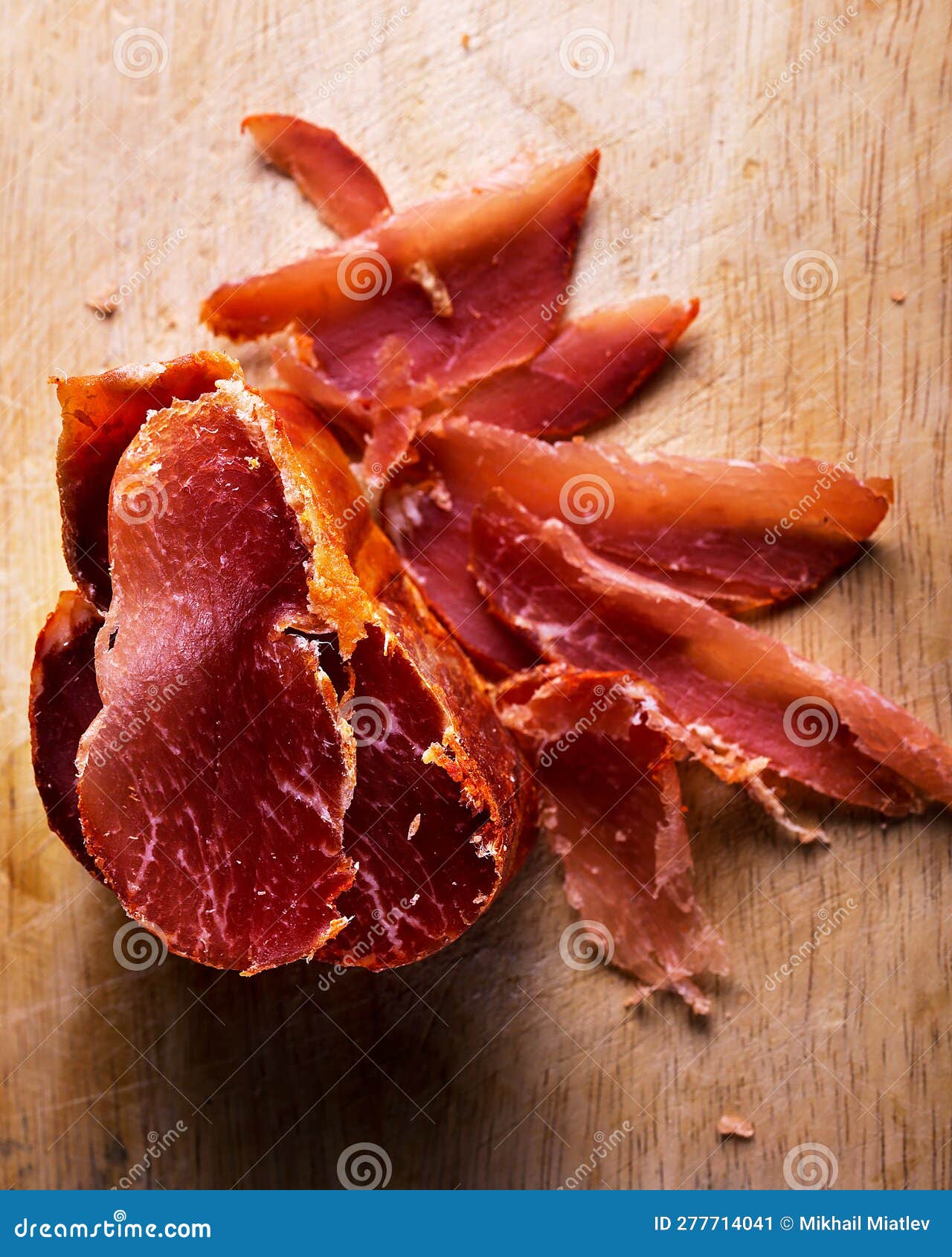 Pork Jerky on a Wooden Board, Sliced Pork Jerky, Top View. Stock Image