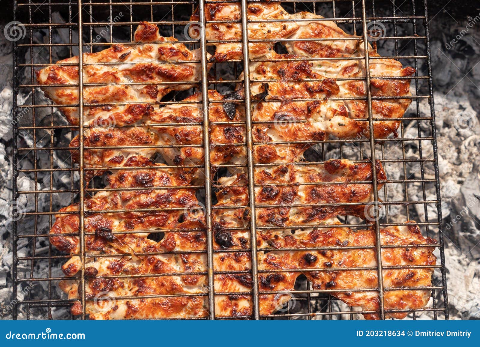 Pork Meat is Grilled on a Grill. Cooking Pork Steaks Stock Photo
