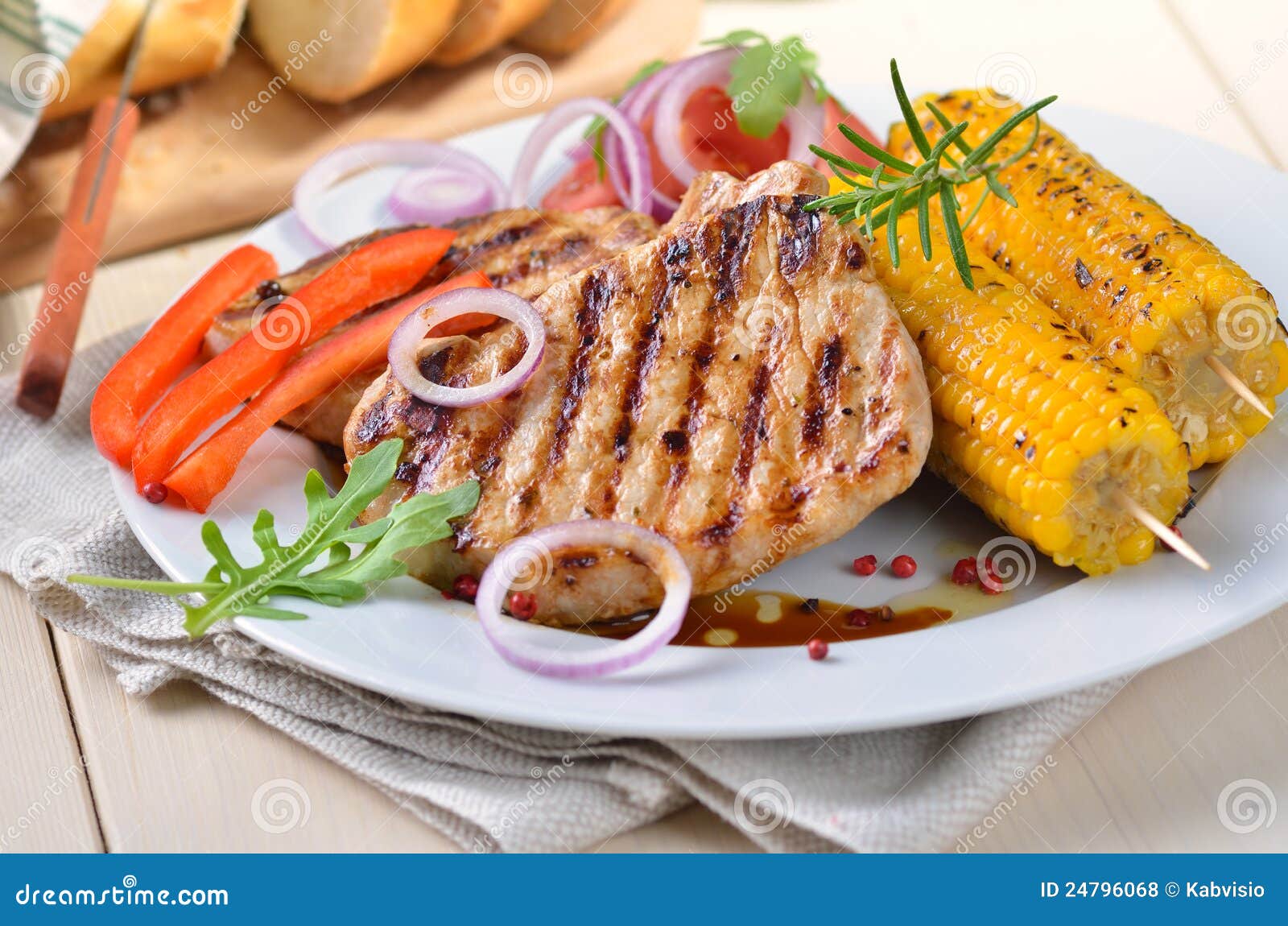 Pork steaks and vegetables stock photo. Image of rings 24796068
