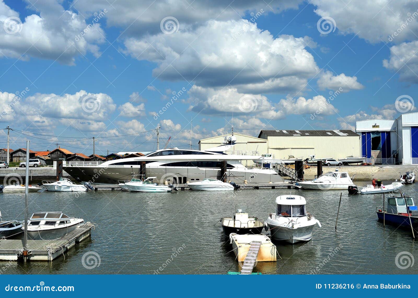 Port with ship yachts and containers