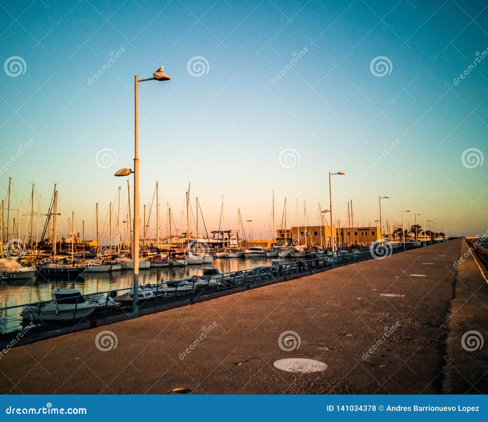 port of burriana at sunset