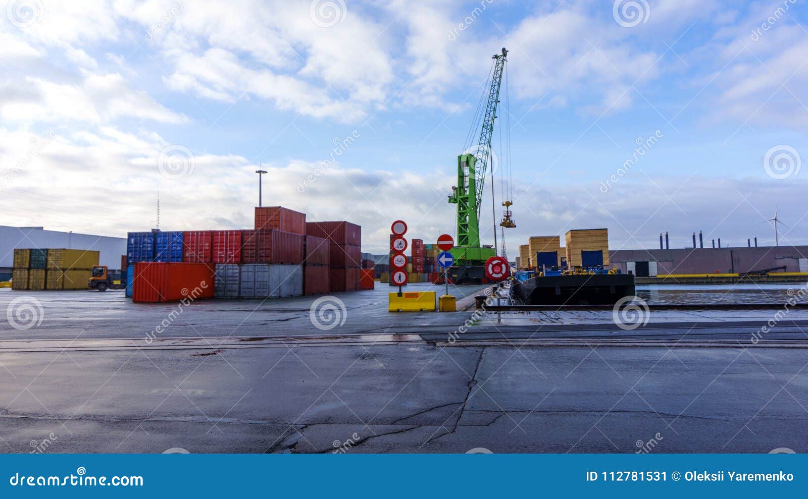 port cranes and stacks of shipping containers . shipping containers .