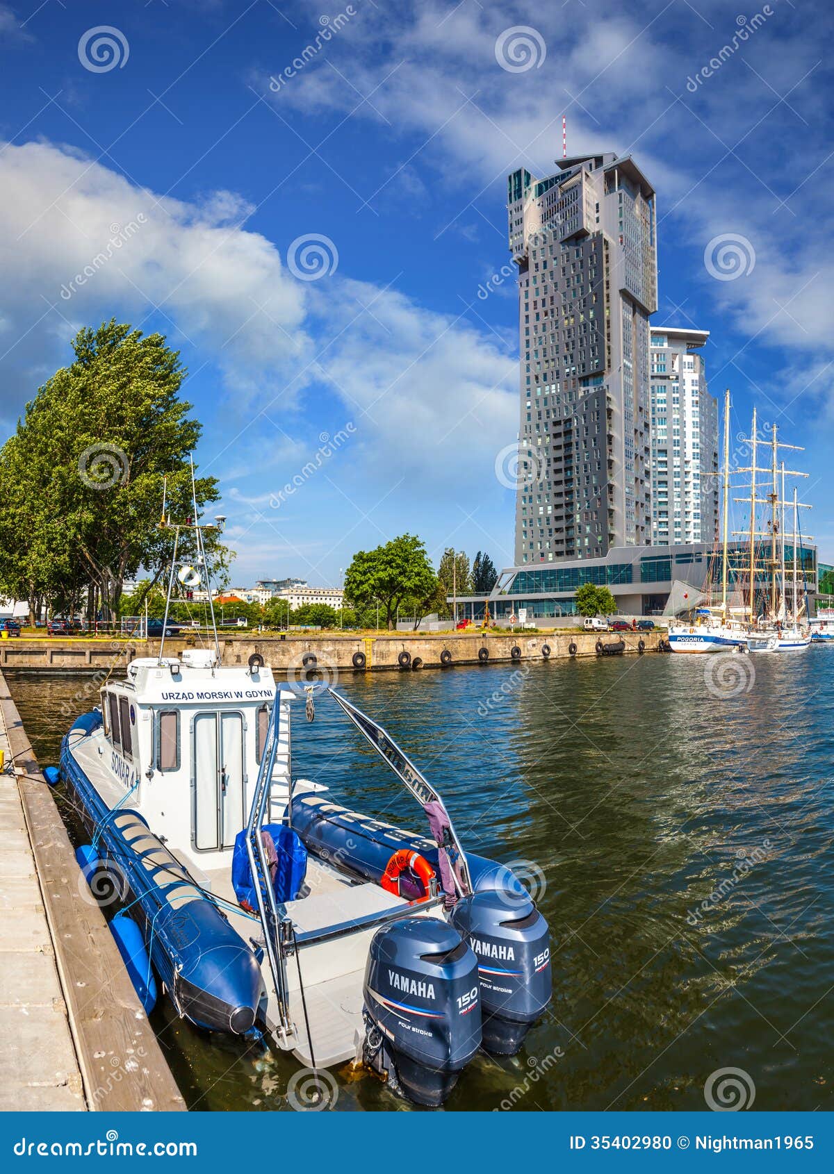Port of Gdynia. Fast patrol boat at the quay President in Gdynia, Poland. In the background skyscraper Sea Towers high at 141.6 meters.
