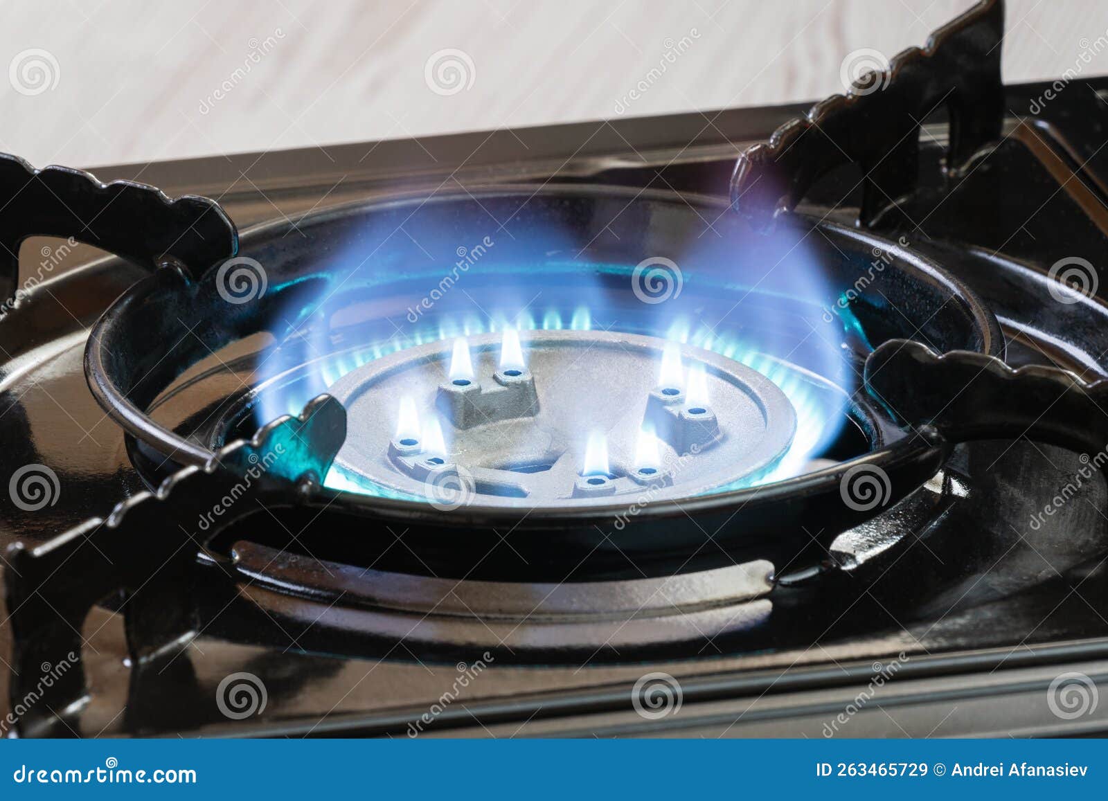 Portable Kitchen Gas Stove with a Burning Blue Flame Stock Image