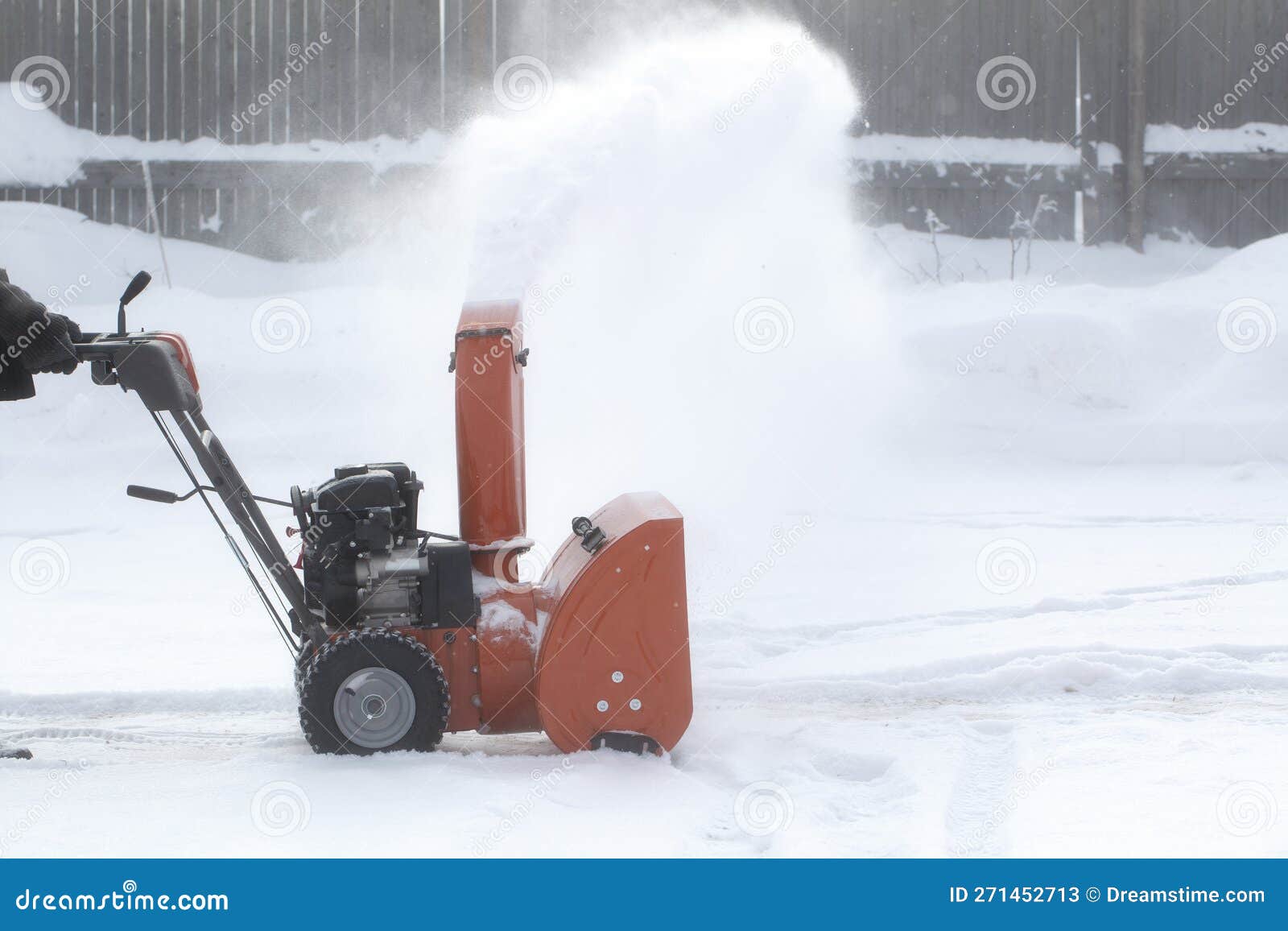 A Portable Snow Blower Powered by Gasoline. Snow Removal in Winter