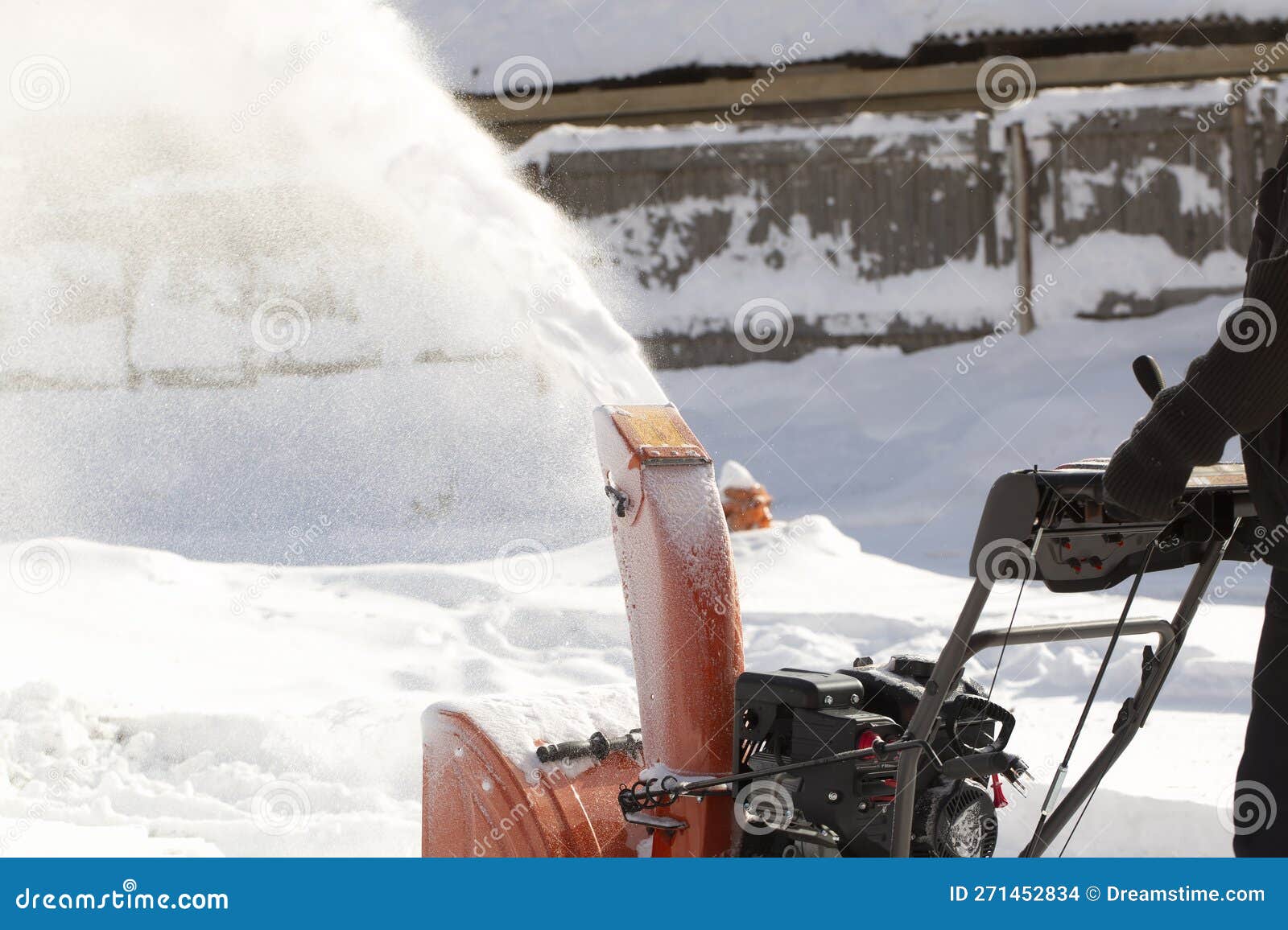A Portable Snow Blower Powered by Gasoline. Snow Removal in Winter