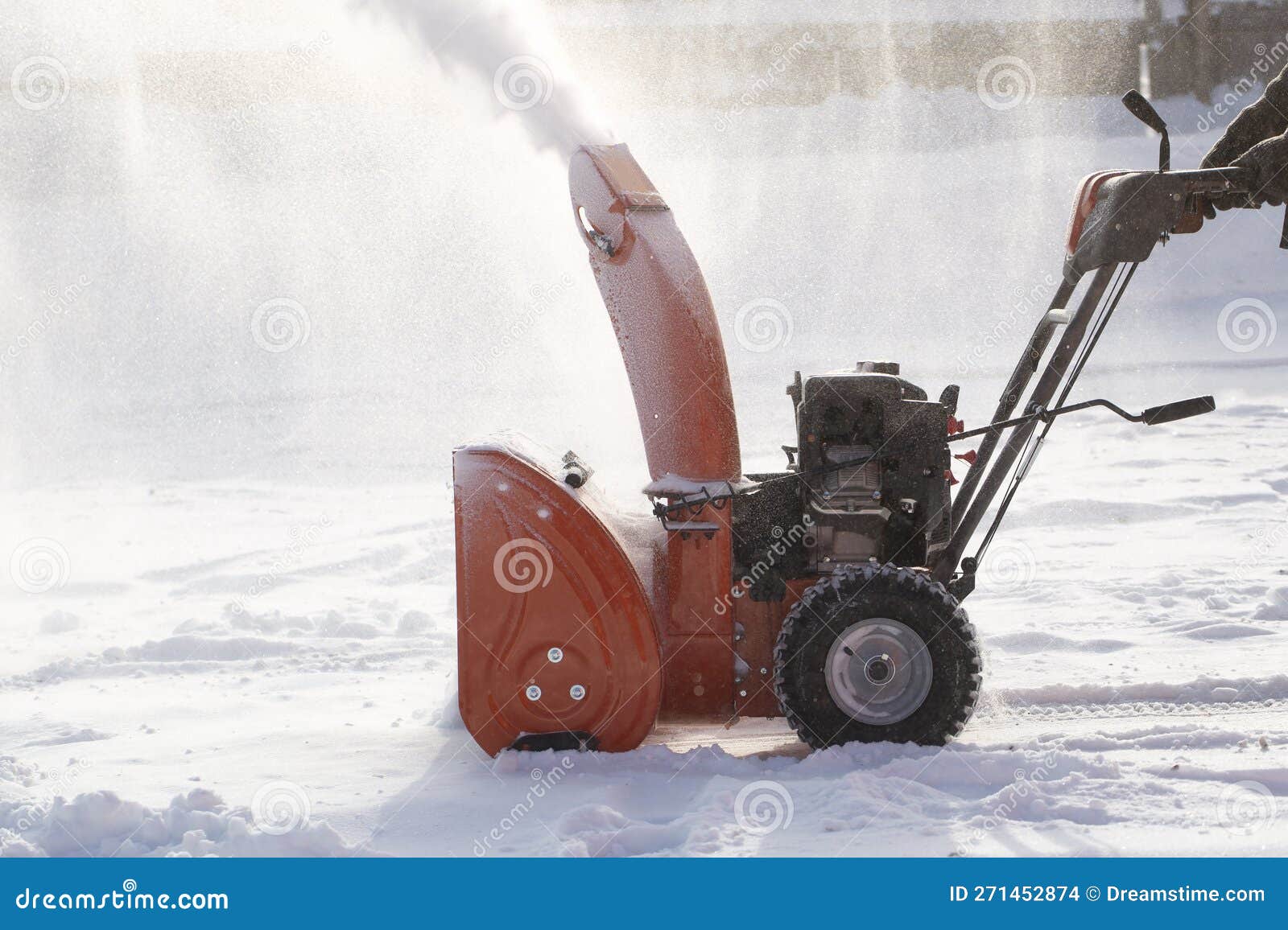 A Portable Snow Blower Powered by Gasoline. Snow Removal in Winter
