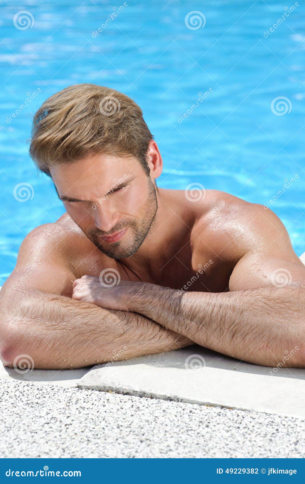 portait of a handsome man by the pool