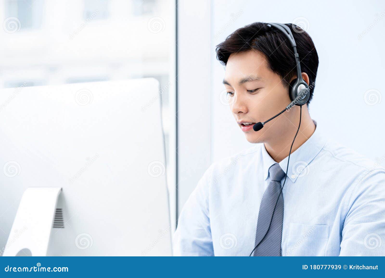 portait of young handsome male asian call center agent