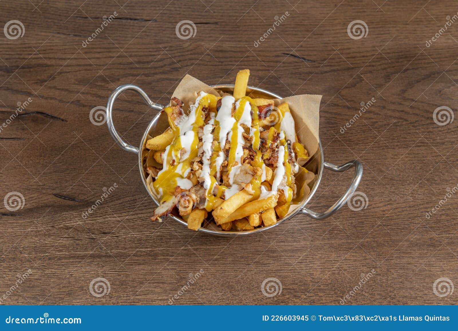 Portion of Chips with Cream Cheese Cheddar Sauce and Fried Bacon Stock