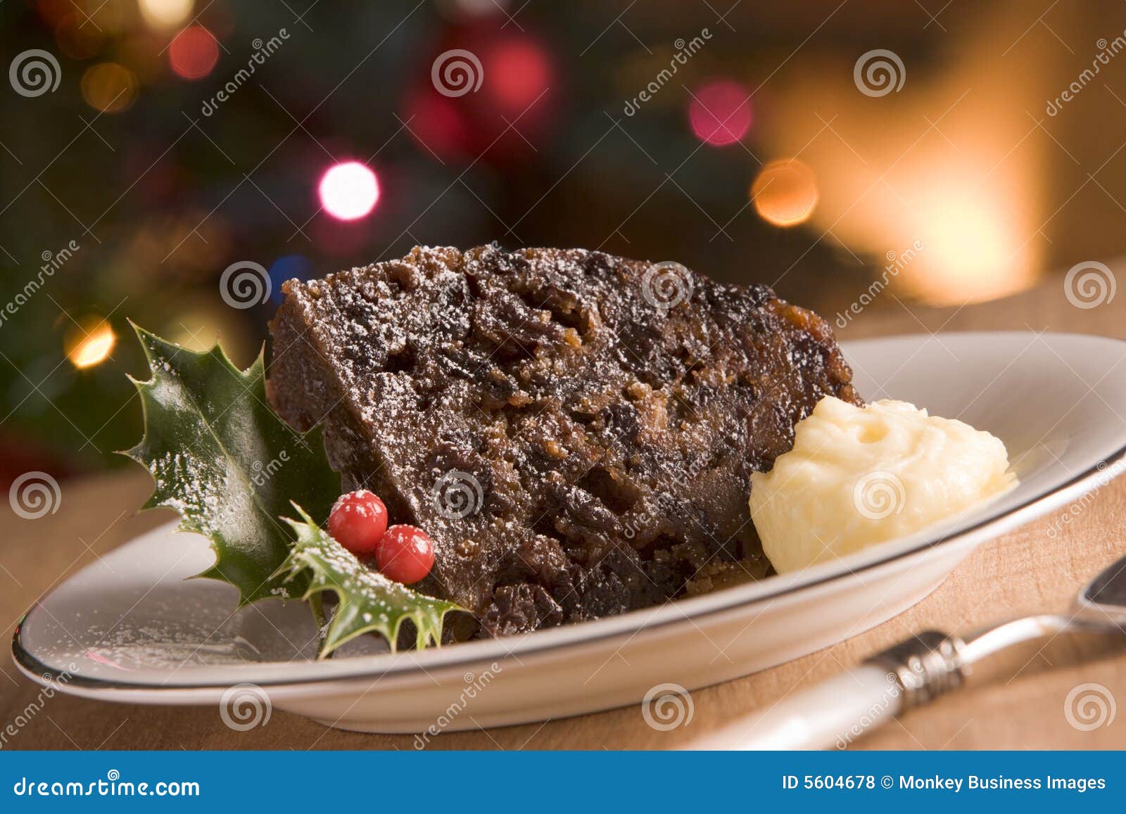 portion of christmas pudding with brandy butter