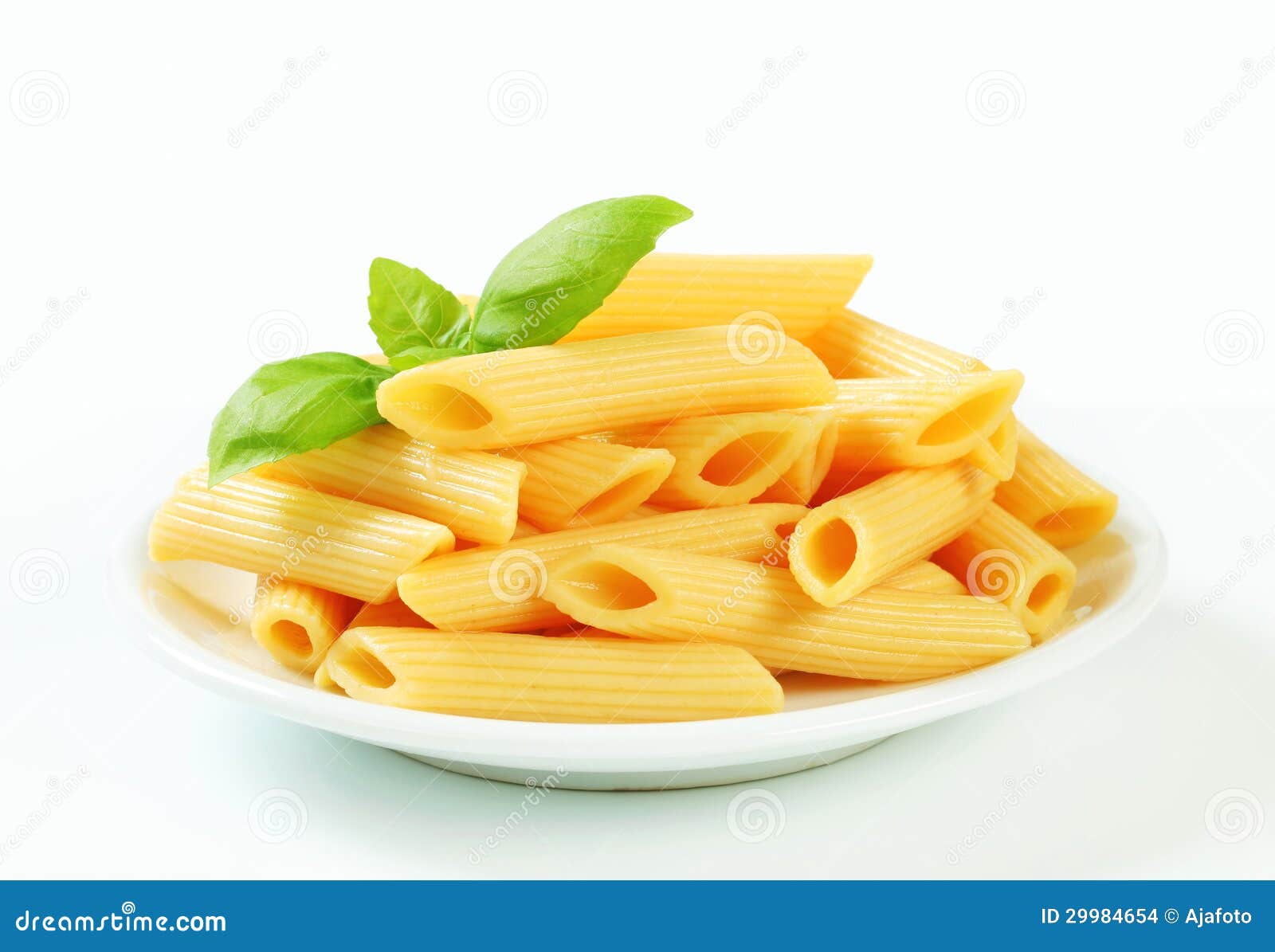 Cooked penne pasta stock photo. Image of basil, closeup 29984654