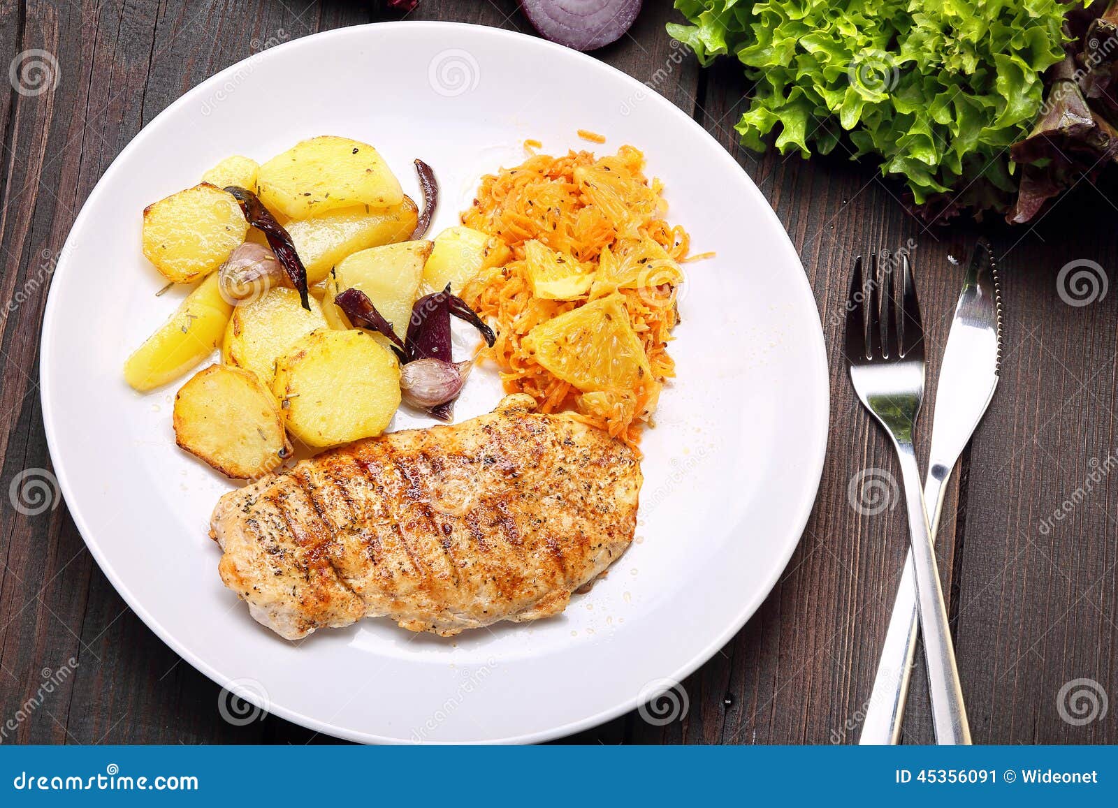 Portion of Grilled Chicken, Baked Potatoes and Carrots Salad Stock
