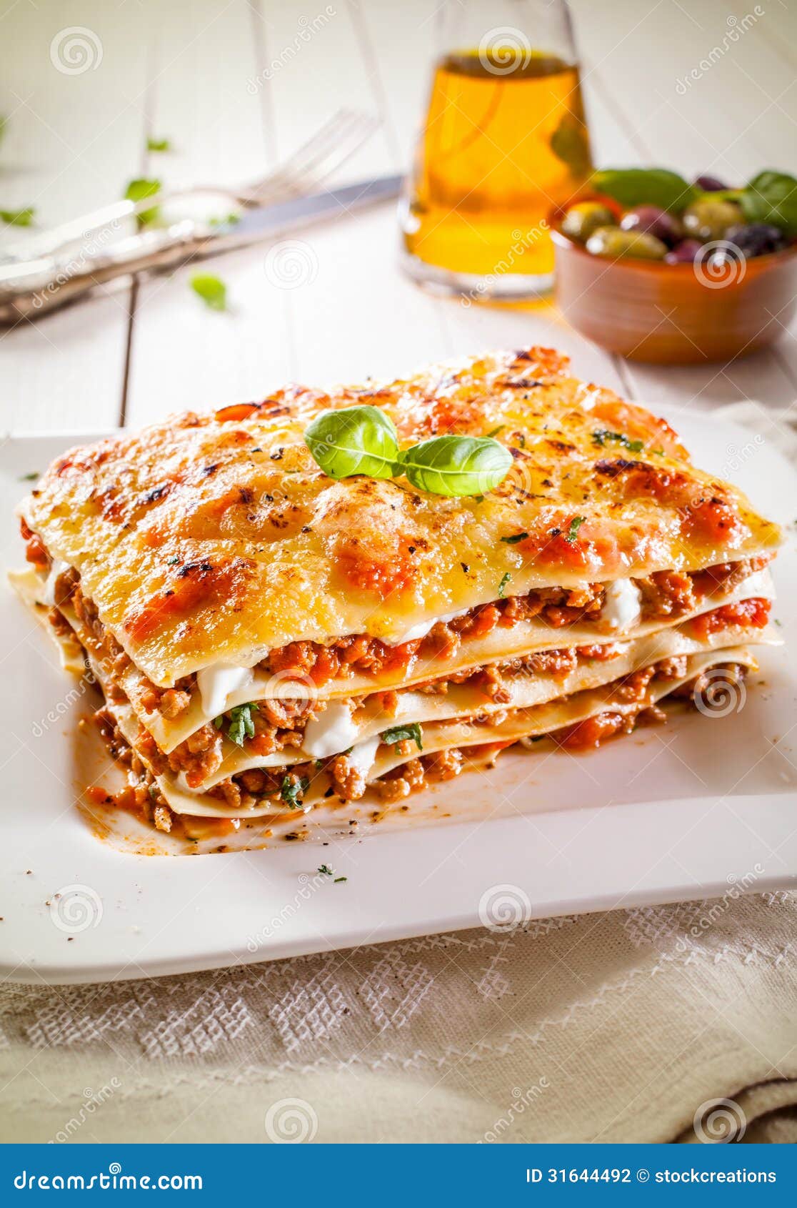 portion of lasagne with bolognese and cheese