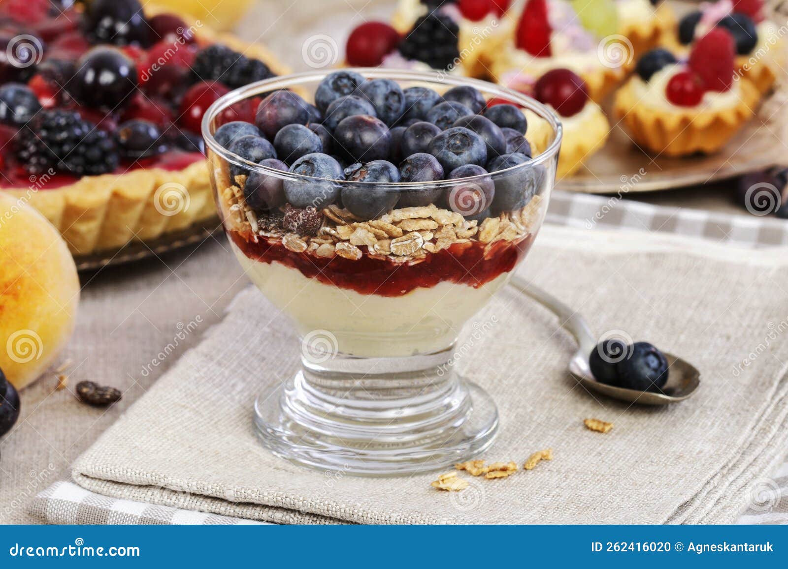 Portion of Layer Dessert with Fresh Fruits and Muesli Stock Photo