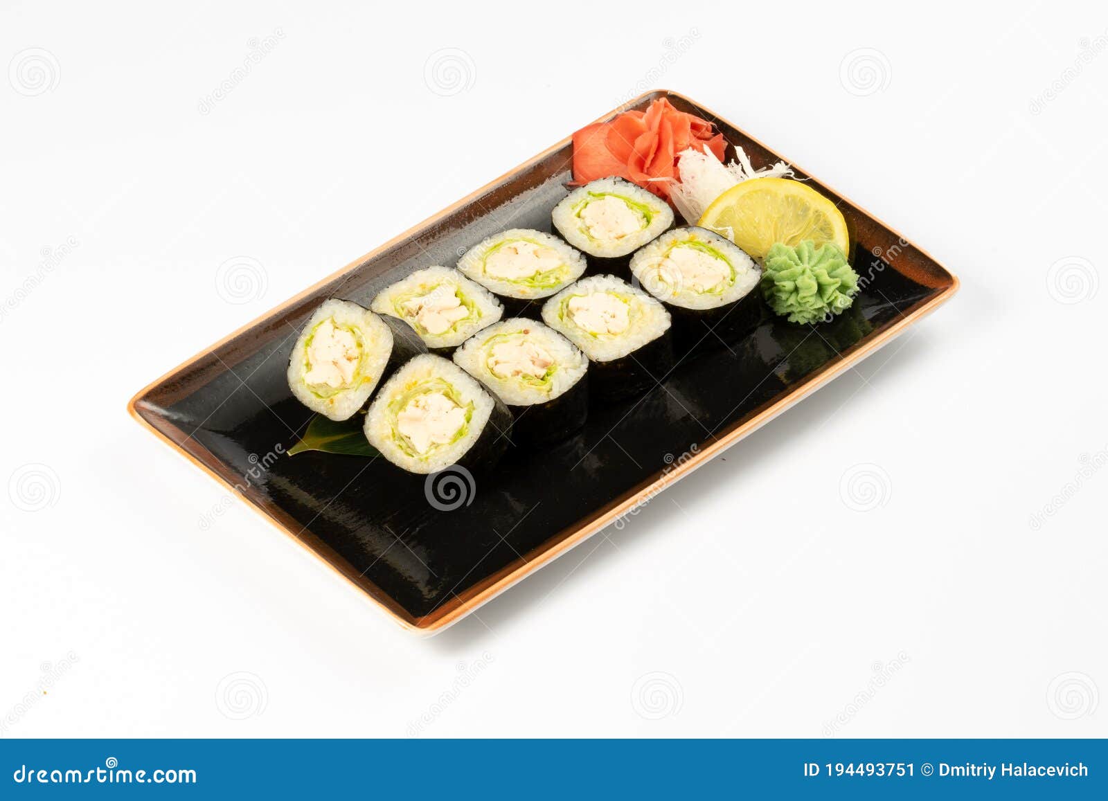 A Portion of Maki Sushi with an Assortment of Japanese Side Dishes in a