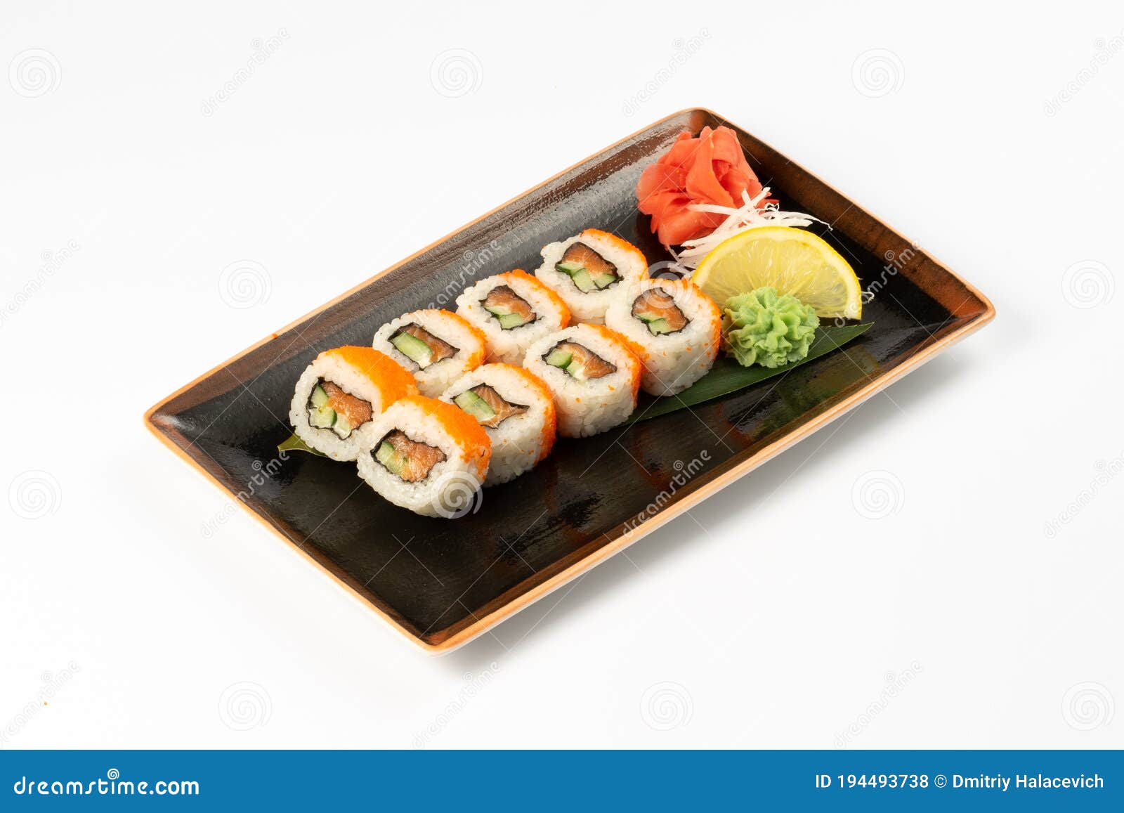 A Portion of Maki Sushi with an Assortment of Japanese Side Dishes in a