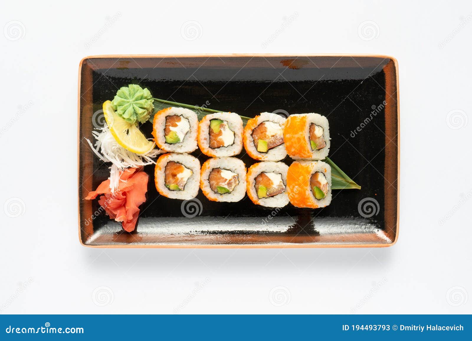 A Portion of Maki Sushi with an Assortment of Japanese Side Dishes in a