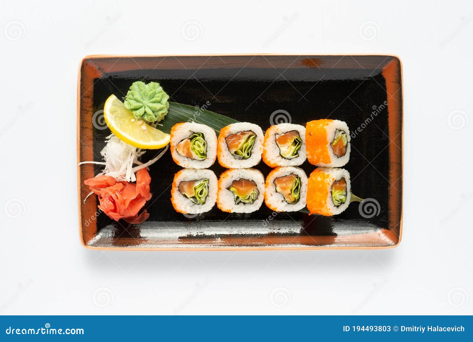 A Portion of Maki Sushi with an Assortment of Japanese Side Dishes in a