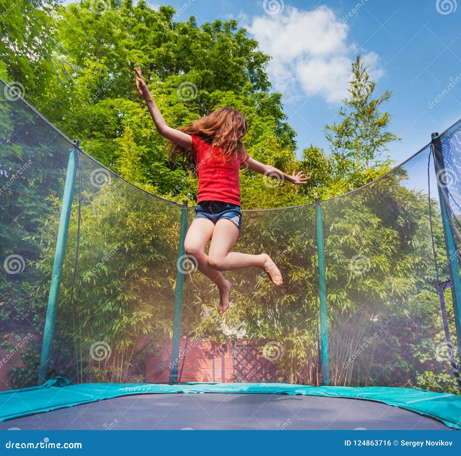 Girl Bouncing On A Trampoline Photograph By Ian Hooton Fine Art America