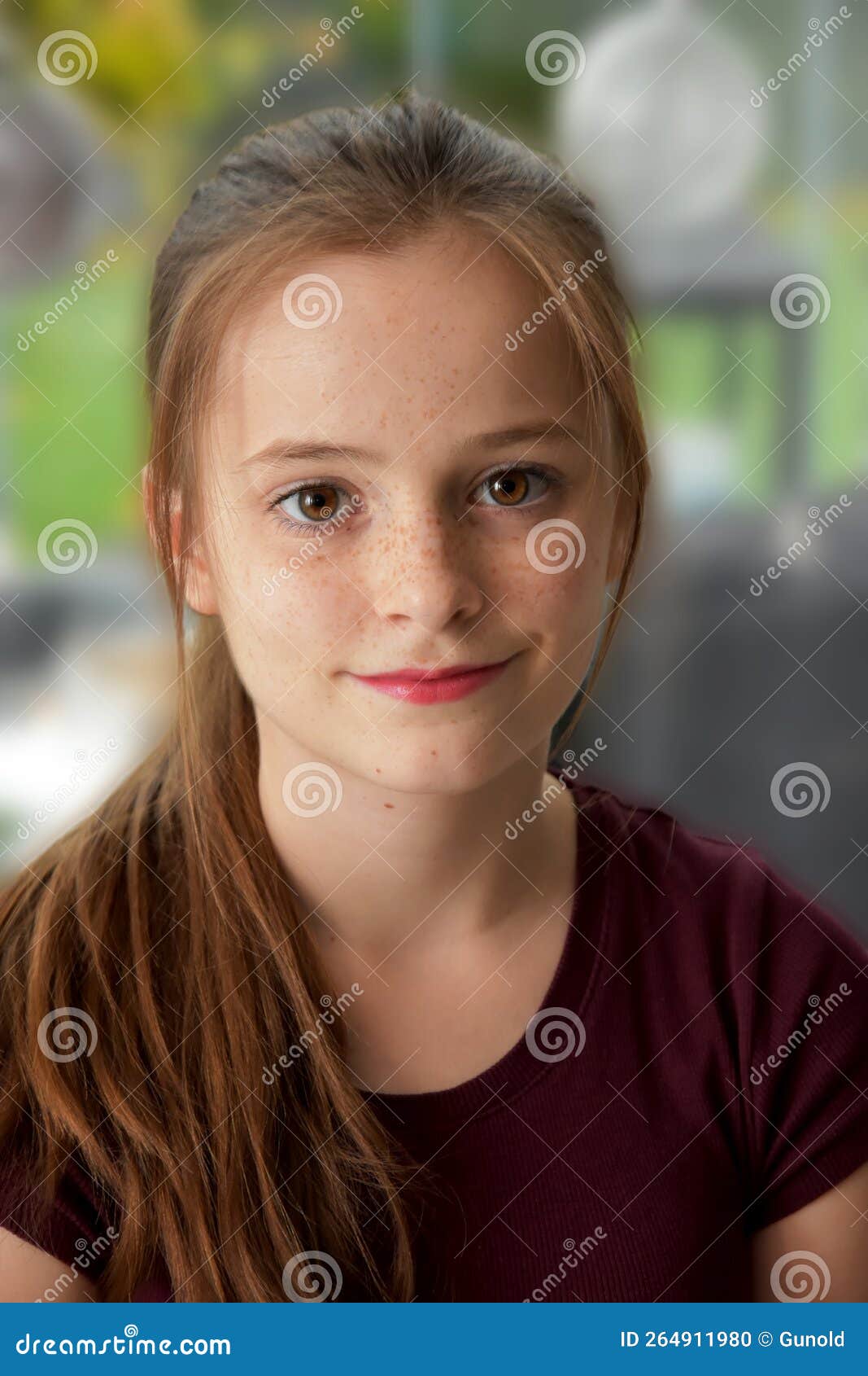 cheerful teenager girl with freckles