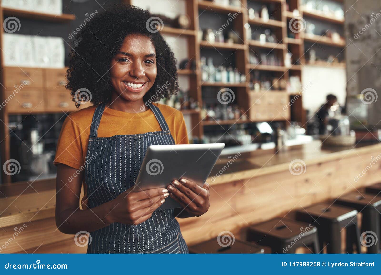 portrait of an african young female cafe owner