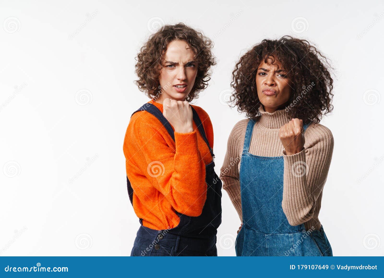 Portrait Of Angry Multinational Women Showing Fists At Camera Stock