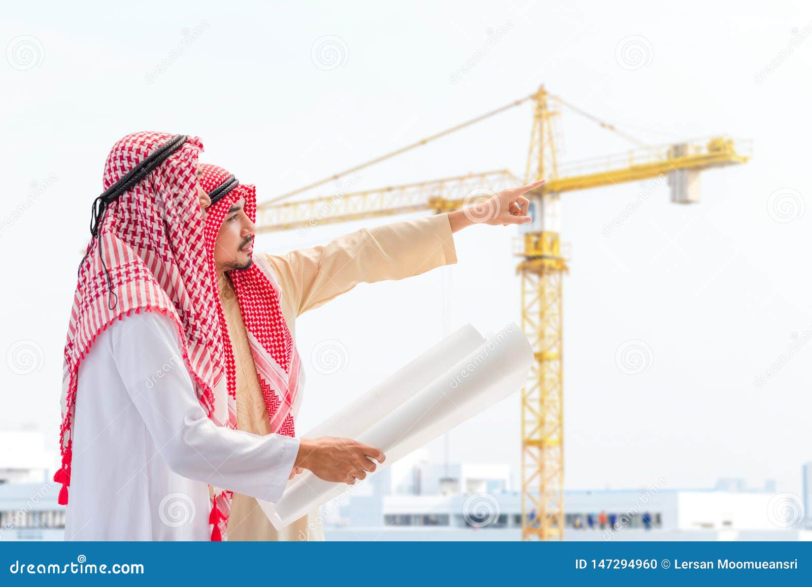 Portrait of Arabian Engineer Talking about Saudi Job and Verify the Blueprint with Commitment To