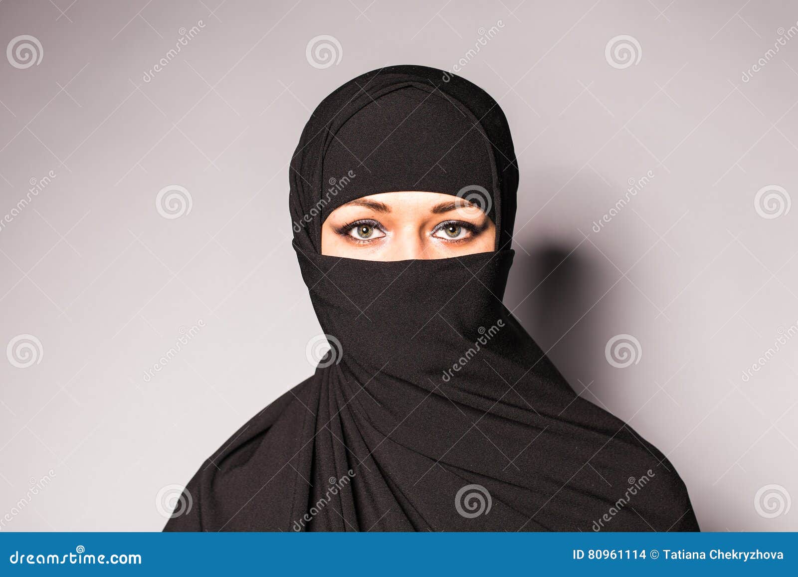 Portrait Of An Arabic Young Woman With Her Beautiful Blue Eyes In