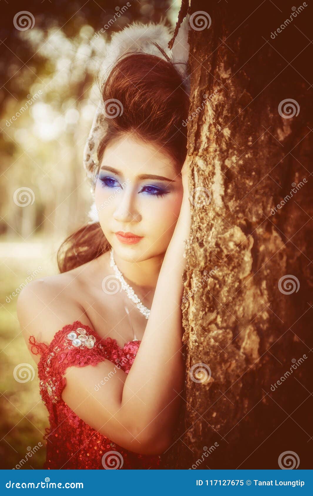 Portrait Of Young Beautiful Woman In Red Dress And Makeup 