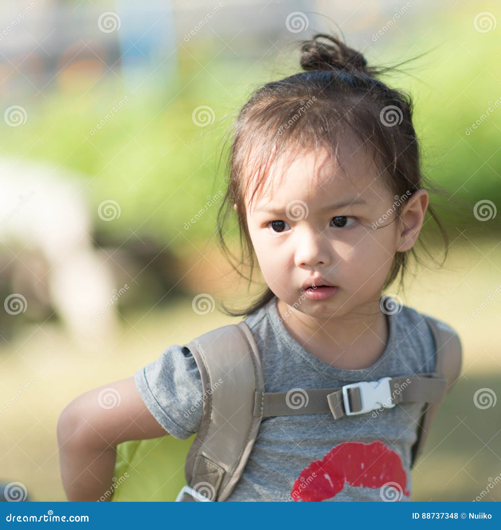 portrait of asian girl with backpack outdoor.