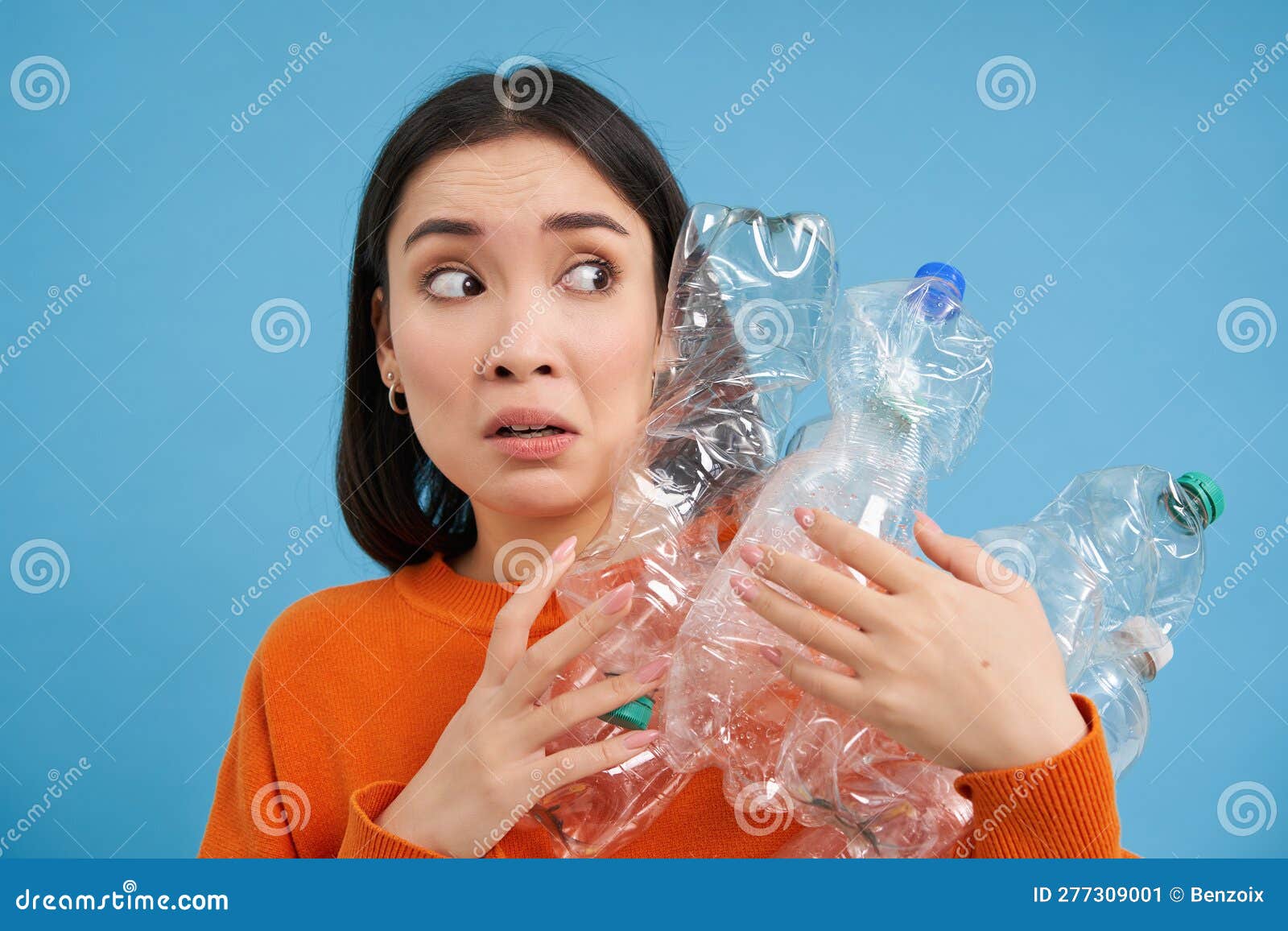 Portrait of Asian Girl with Scared Face, Holding Piles of Plastic ...