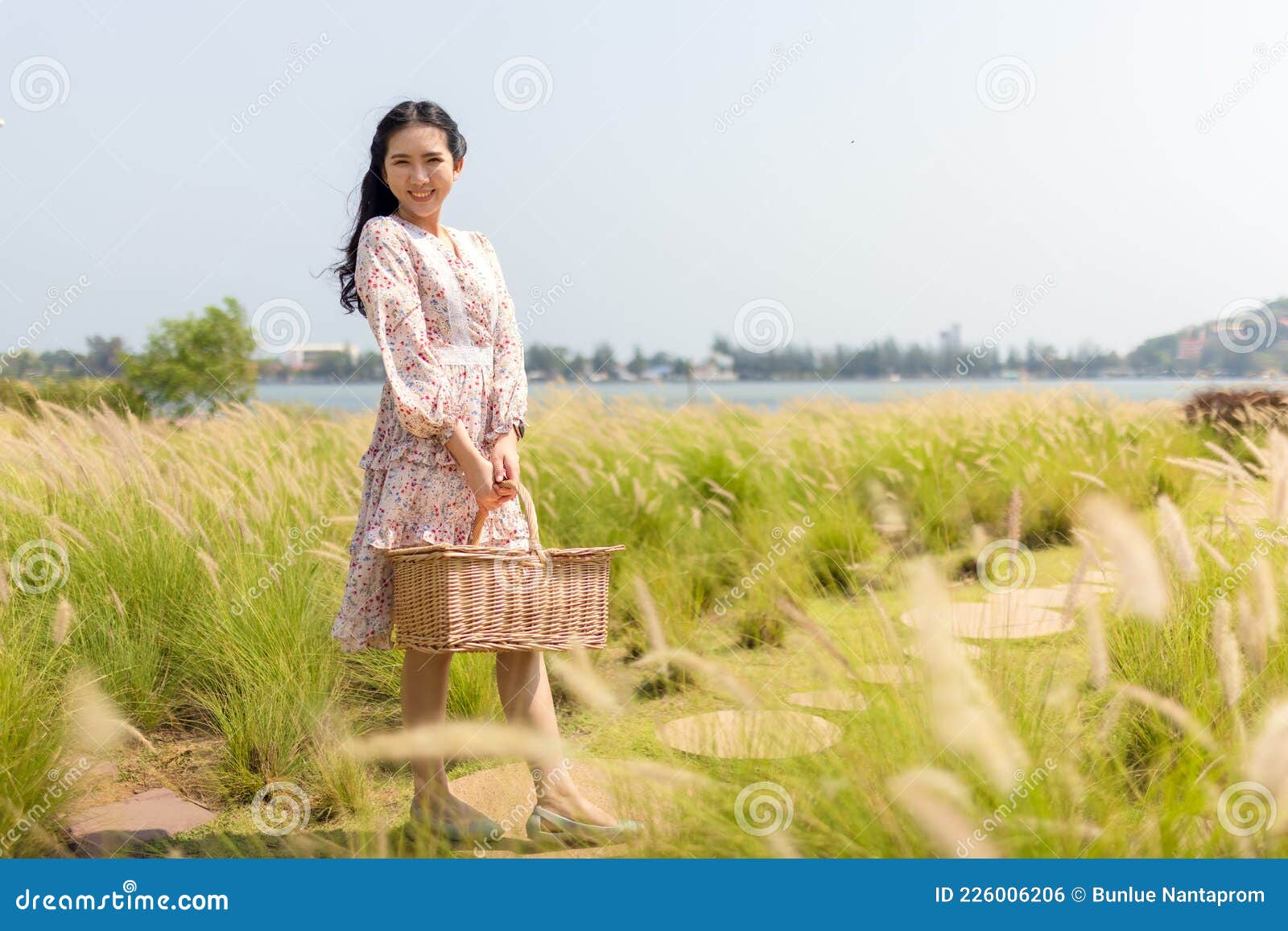 portrait of an asian girl seeking calm and tranquillity in a floral garden