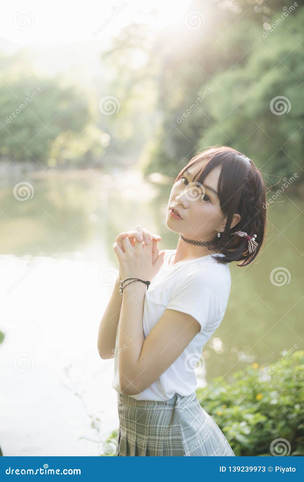 Portrait Of Asian Girl With White Shirt And Skirt Looking In Outdoor Nature Vintage Film Style