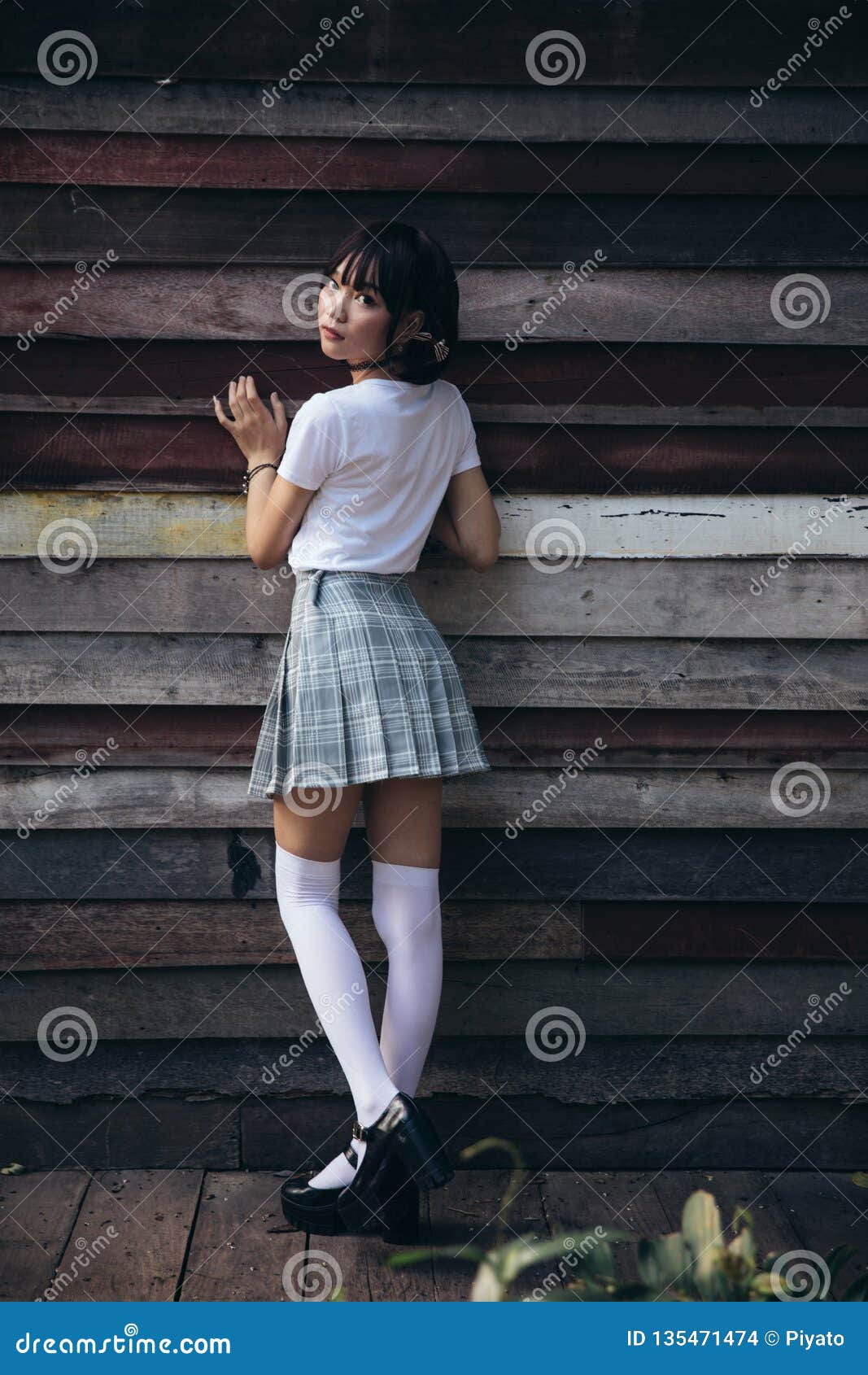 Portrait Of Asian Girl With White Shirt And Skirt Looking In Outdoor Nature Vintage Film Style