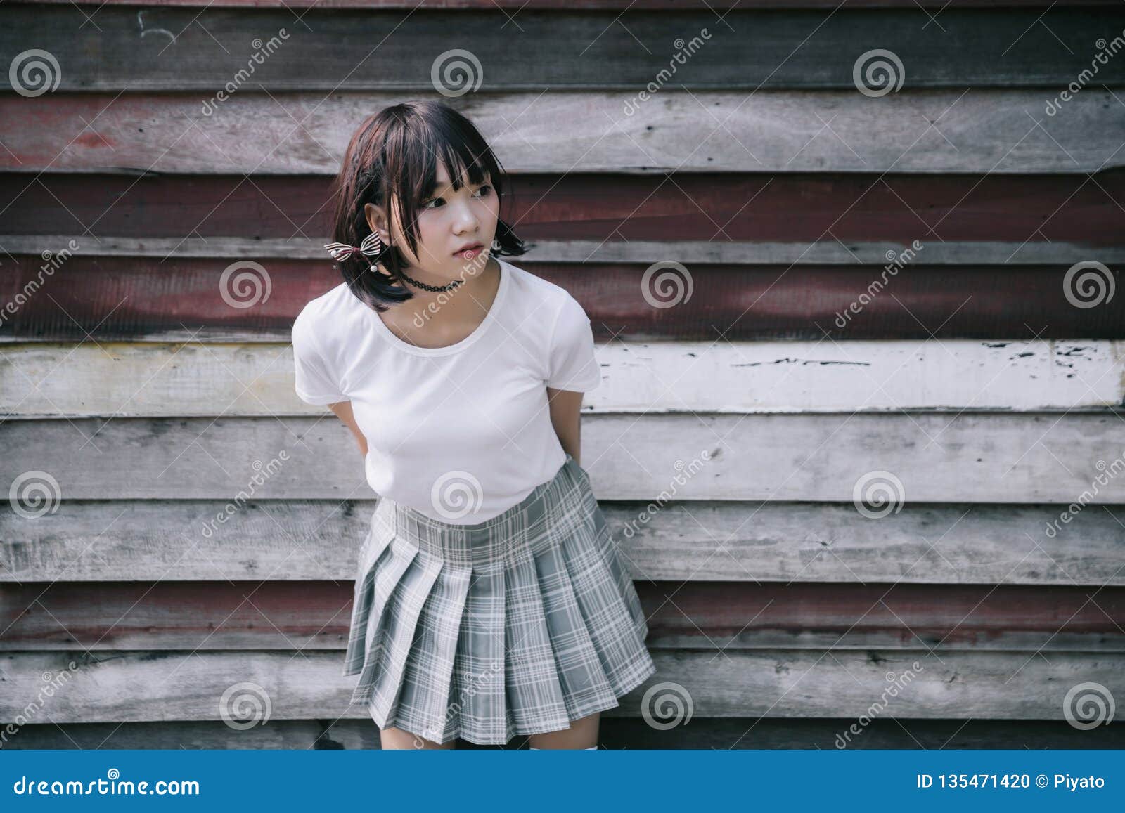 Portrait Of Asian Girl With White Shirt And Skirt Looking In Outdoor Nature Vintage Film Style