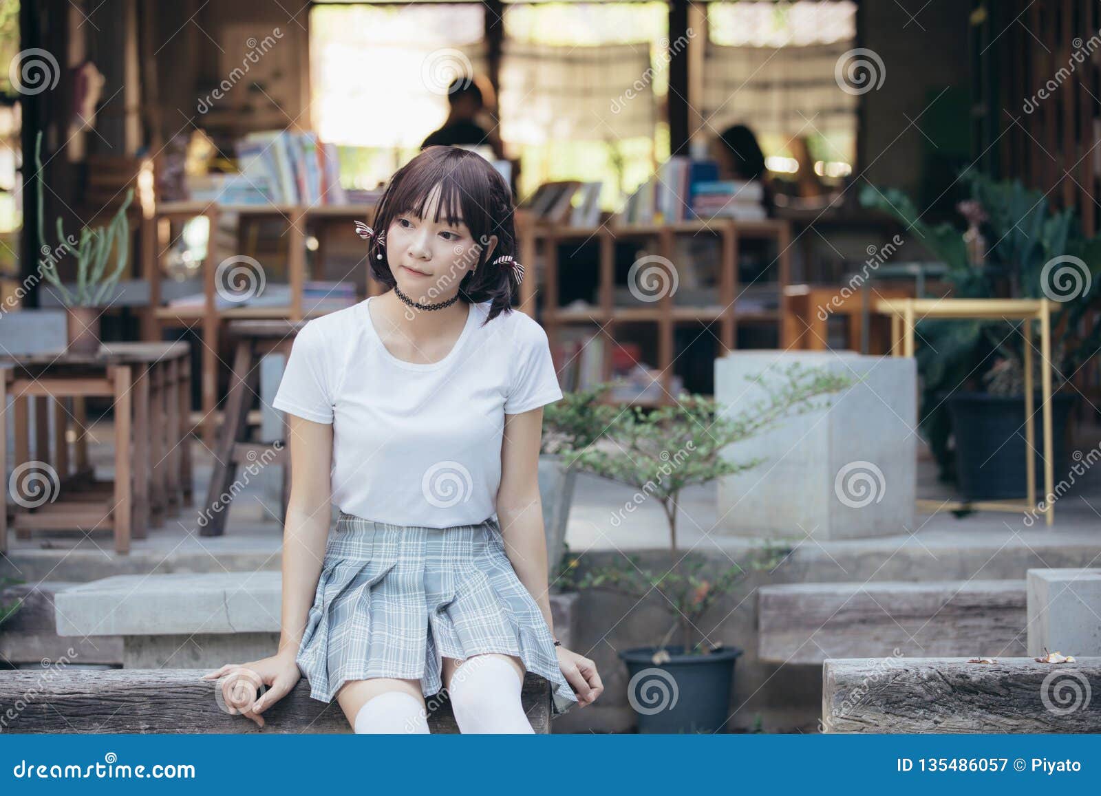 Portrait Of Asian Girl With White Shirt And Skirt Looking In Outdoor Nature Vintage Film Style