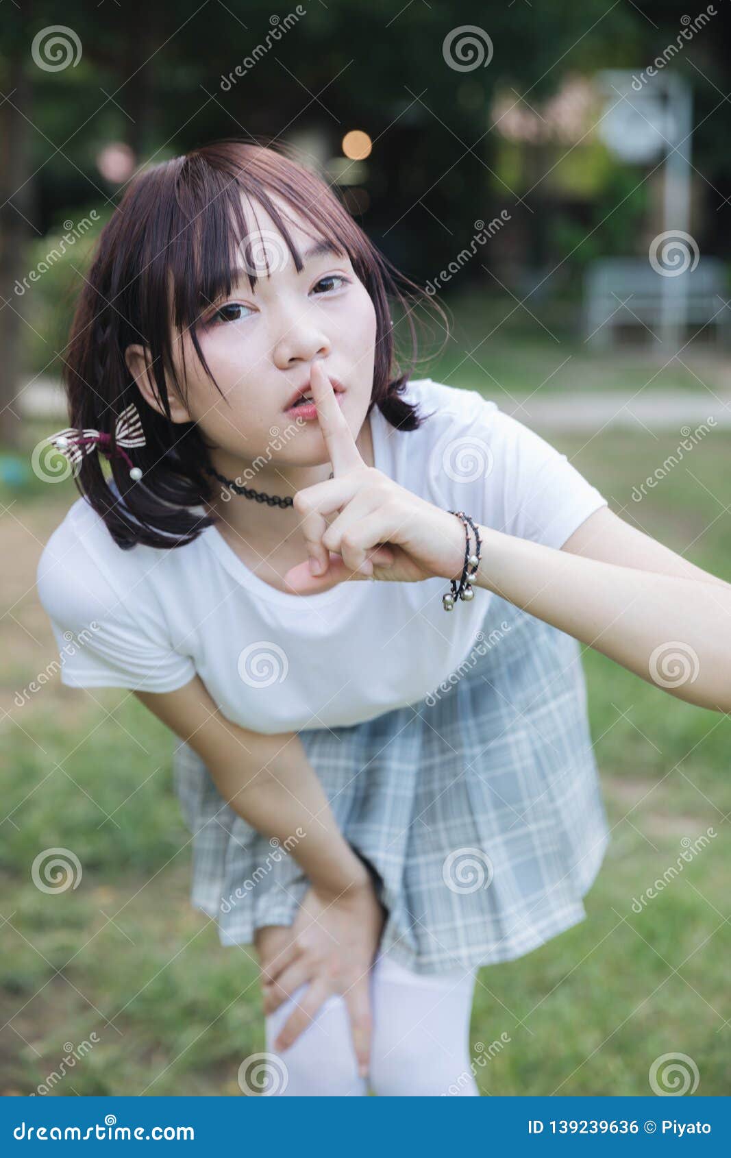 Portrait Of Asian Girl With White Shirt And Skirt Looking In Outdoor Nature Vintage Film Style