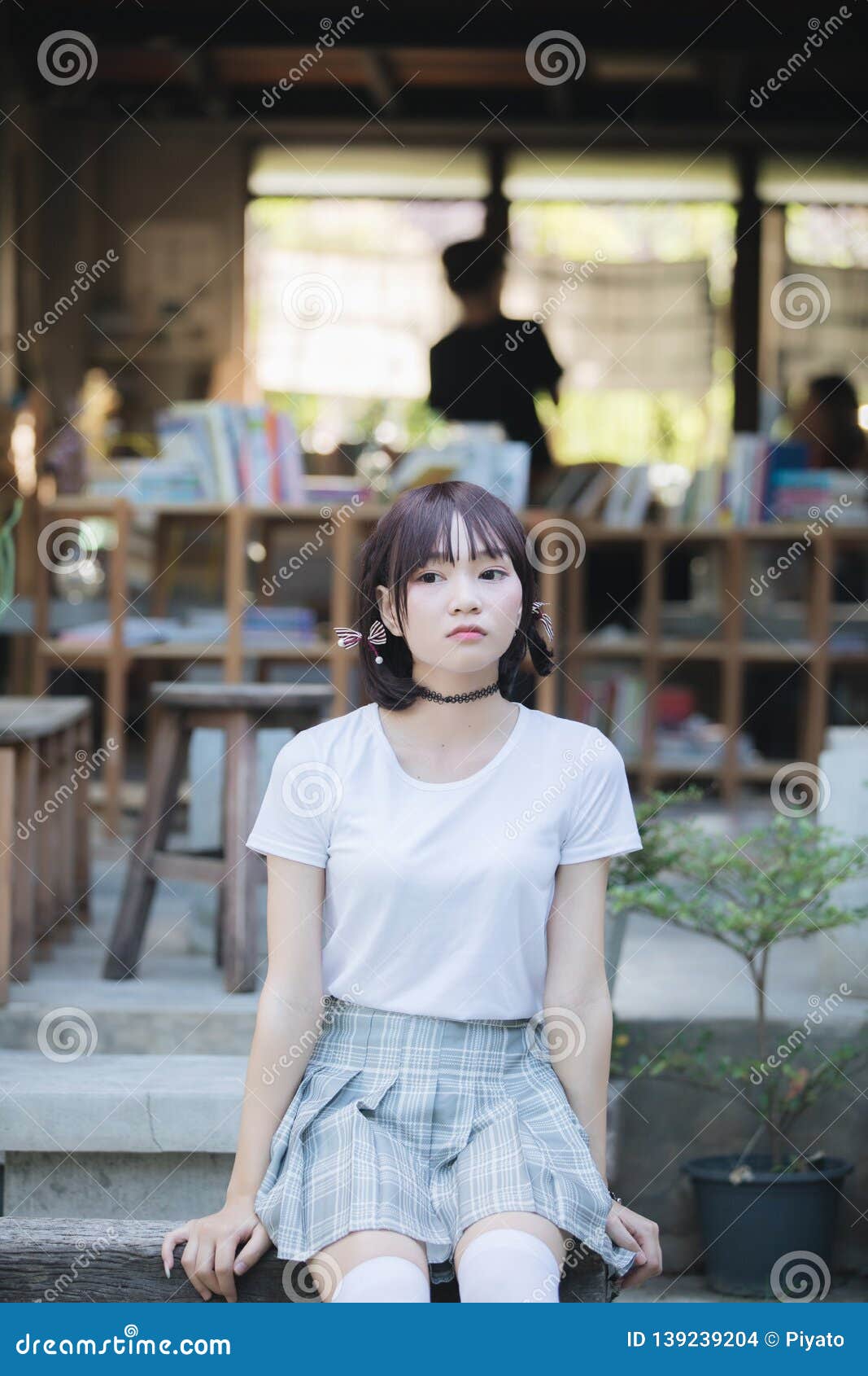 Portrait Of Asian Girl With White Shirt And Skirt Looking In Outdoor Nature Vintage Film Style