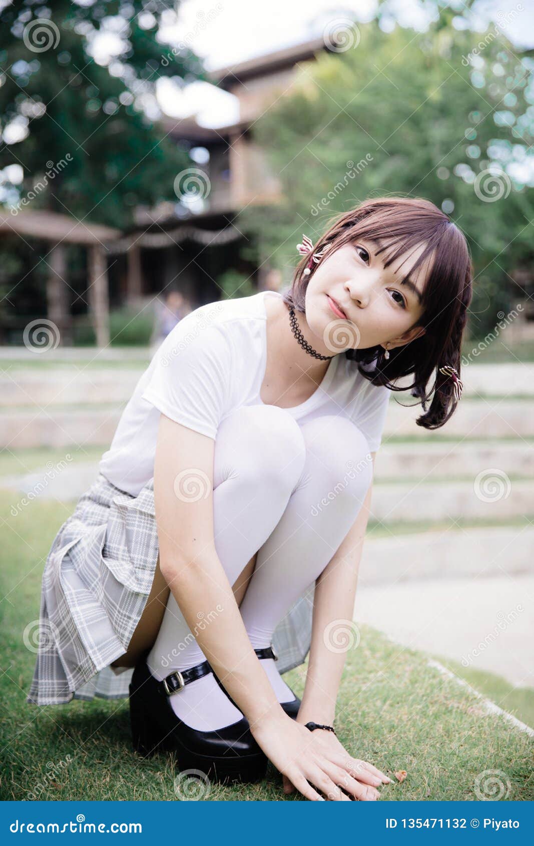 Portrait Of Asian Girl With White Shirt And Skirt Looking In Outdoor Nature Vintage Film Style