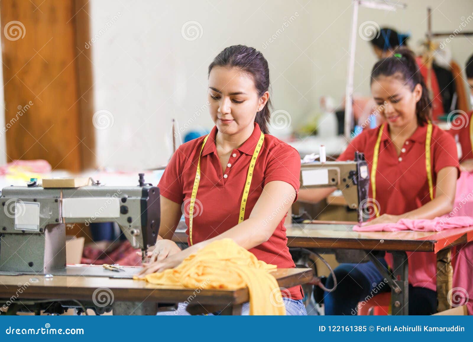 Asian Seamstress in Garment Factory Sewing with Industrial Sewin Stock ...