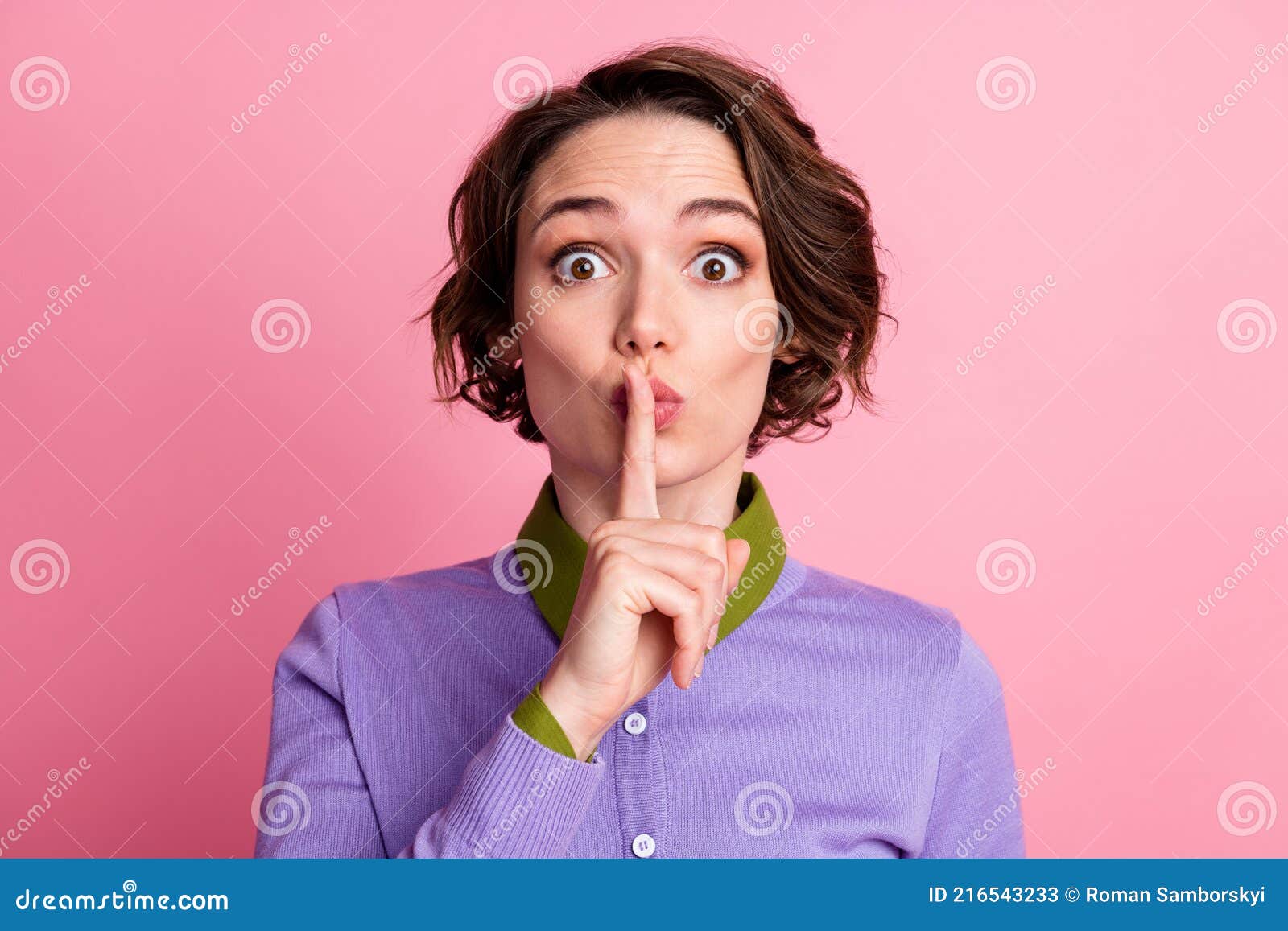 Portrait Of Astonished Girl Private Secret Put Index Finger Mouth Wear