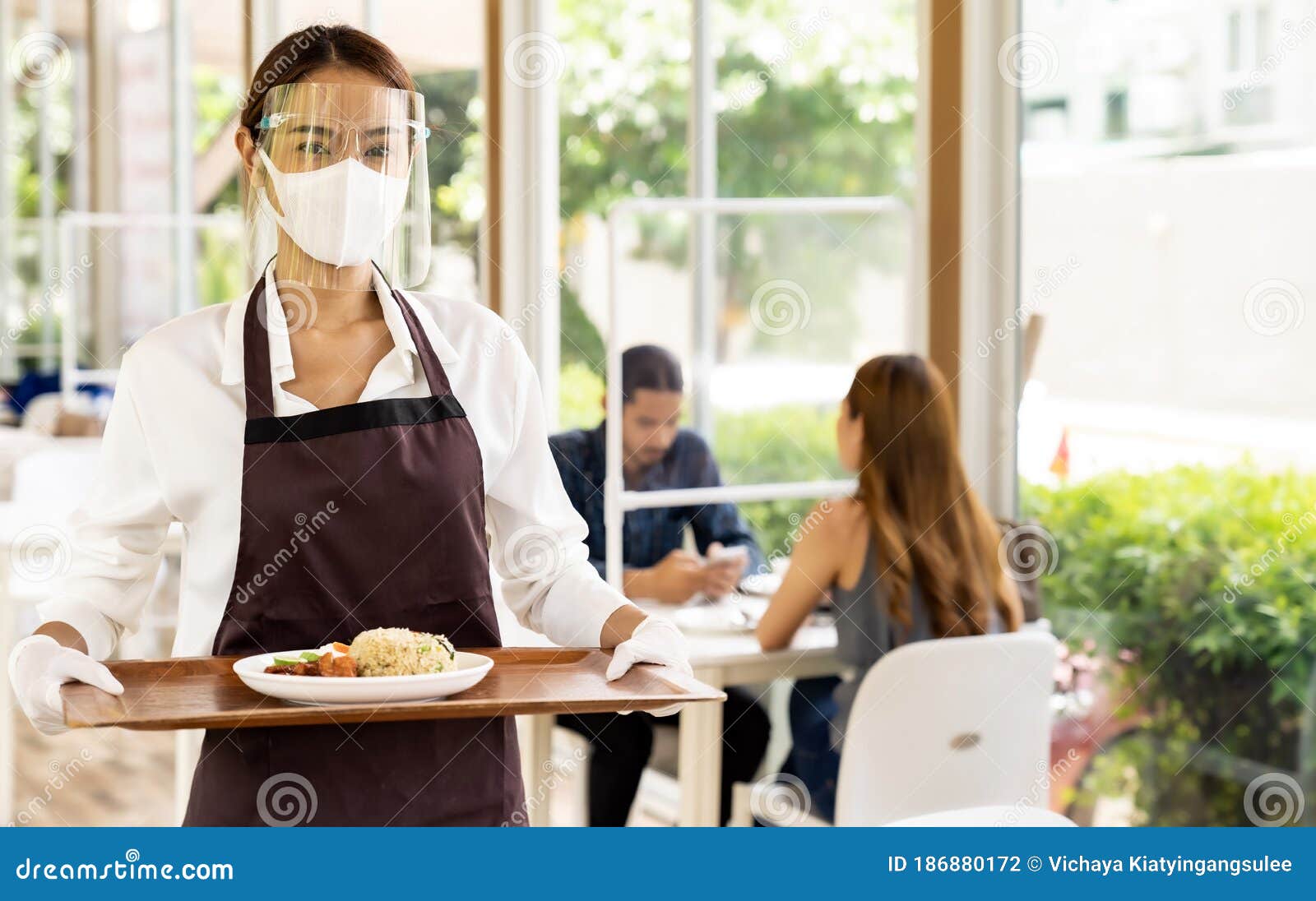 Asian Waitress Talking With Client In Restaurant Stock Image 22629091