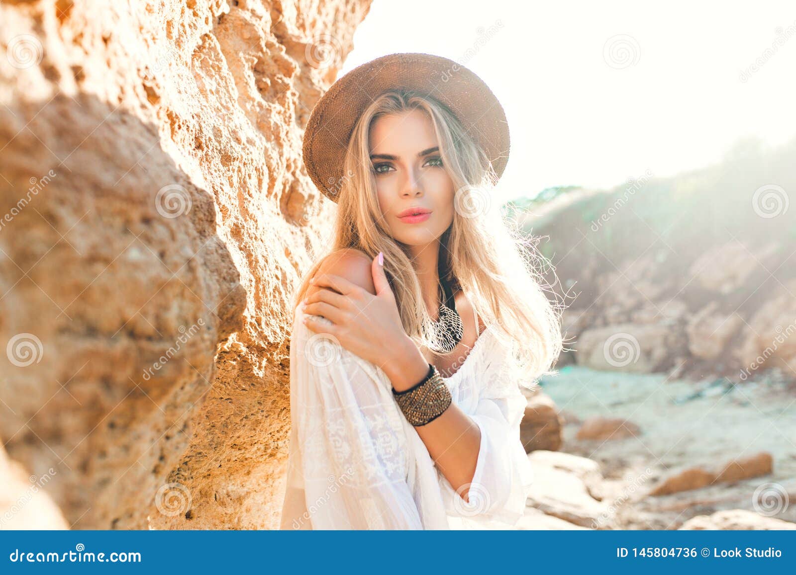 Portrait Of Attractive Blonde Girl With Long Hair Posing To The Camera 