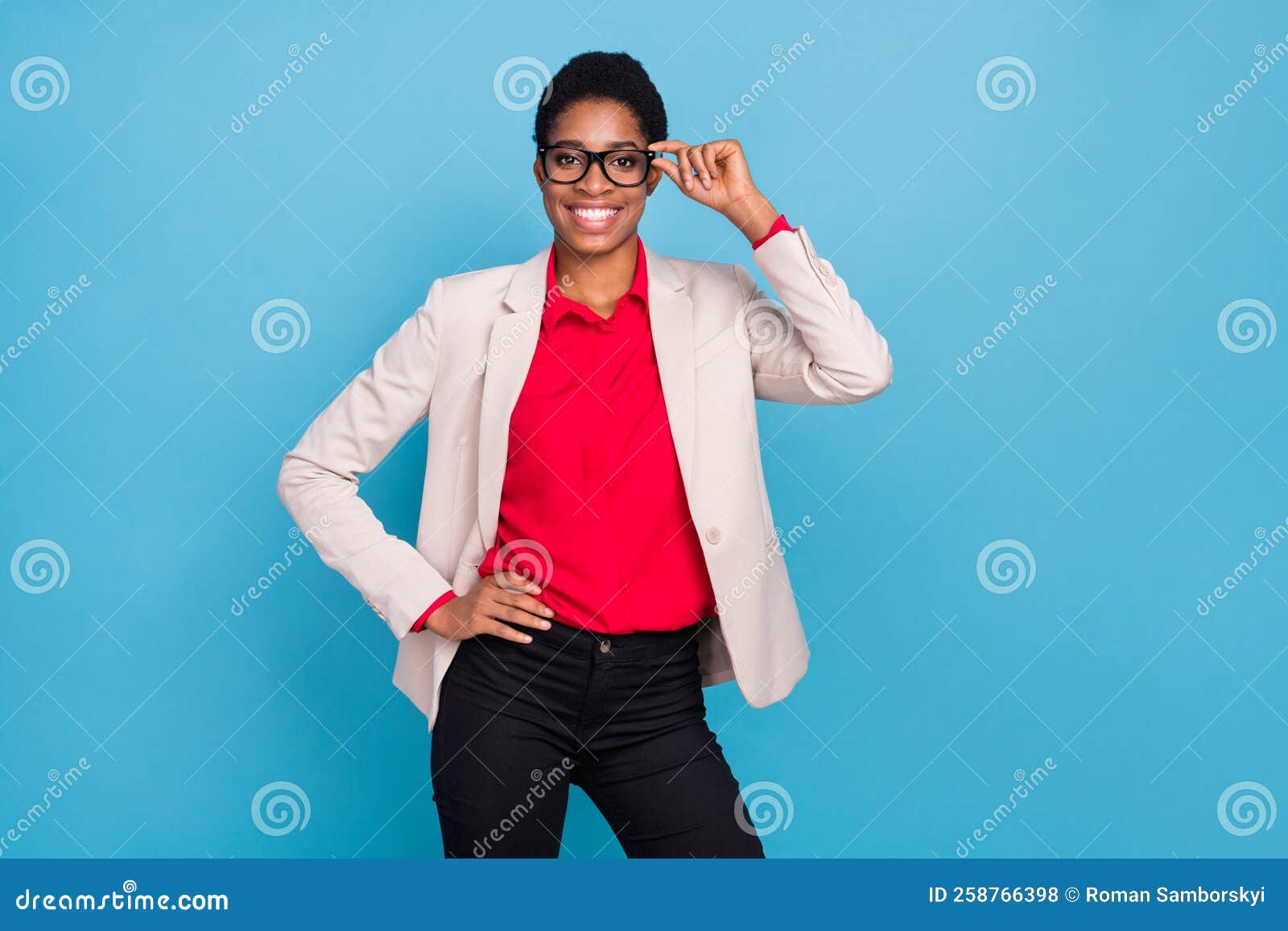 wearing a round glasses. Posing confident