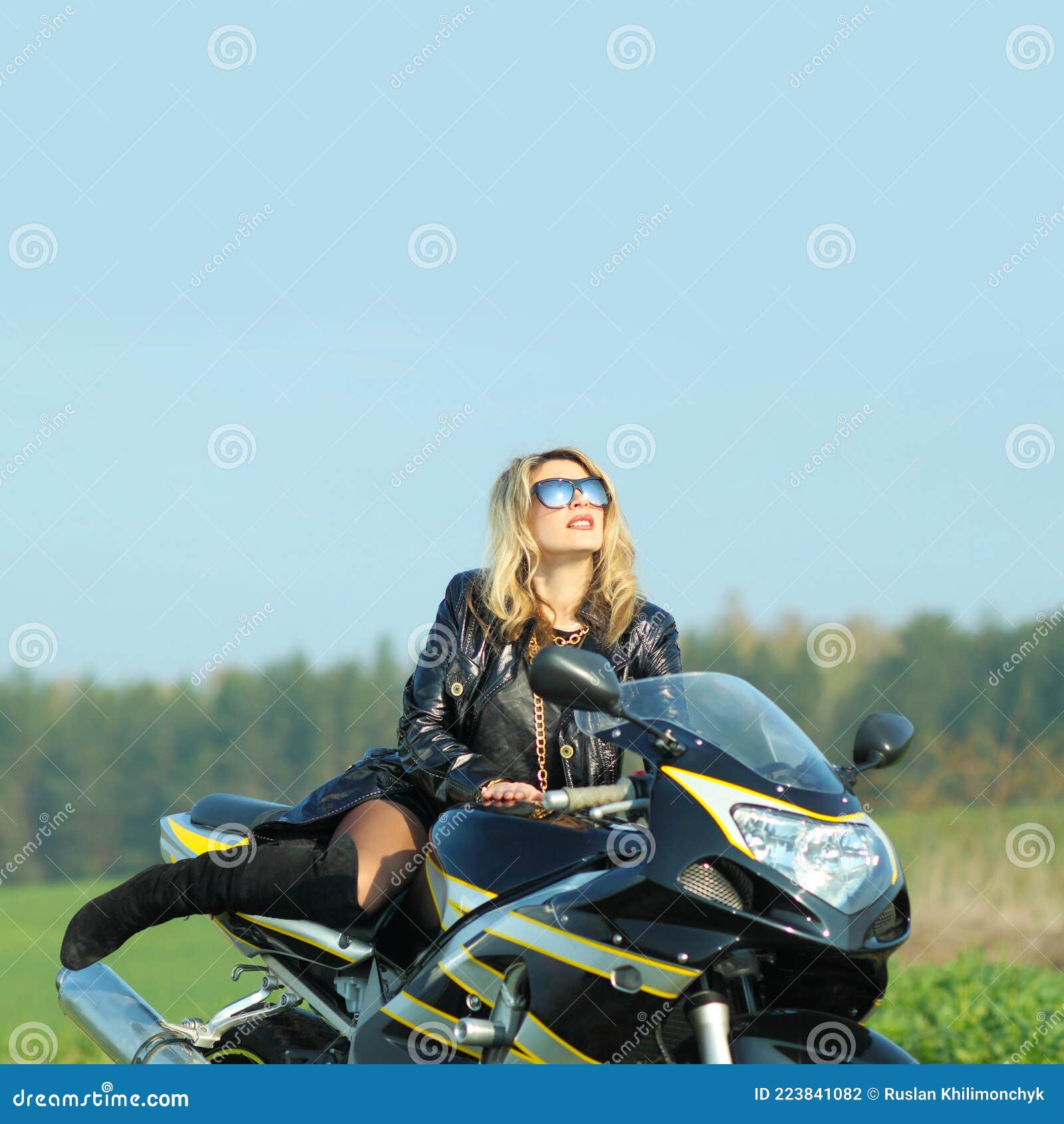 Portrait of a Beautiful Blonde Woman on a Sports Motorcycle Stock Photo ...