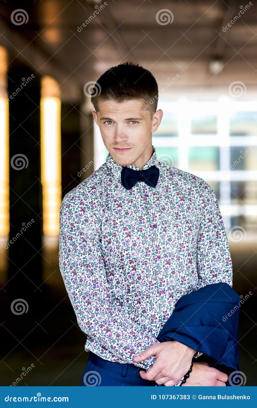 Portrait of an Attractive Man in Shirt with Floral Print and Bow Tie ...