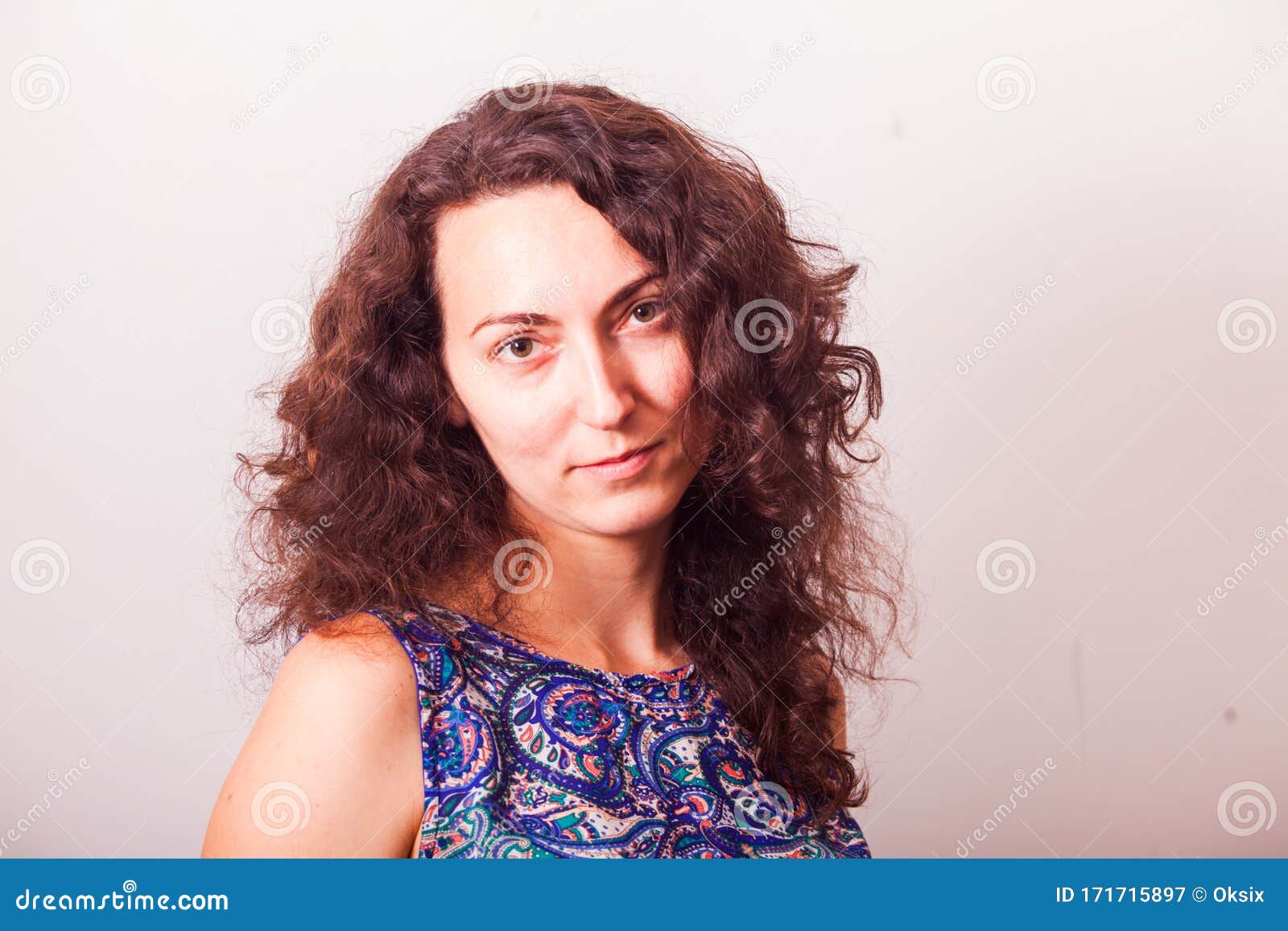 Portrait of Attractive Middleaged Woman with Curly Hair Stock Image