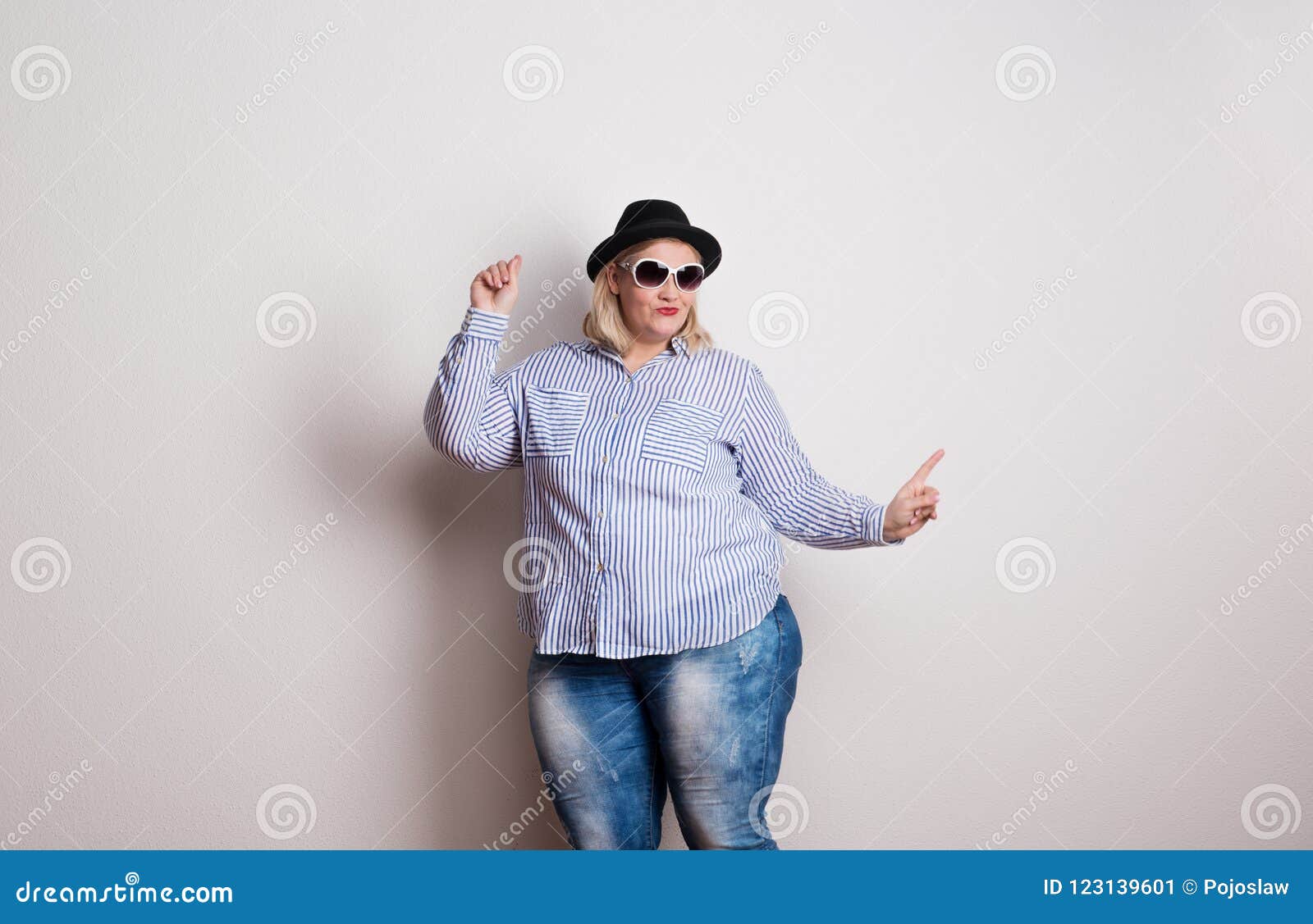 Pretty Plus-size Fat Woman In Fashion Sunglasses And Colorful Clothes Does  Fashion Selfie Like She Is Nice And Shy Girl On Mint Background Stock  Photo, Picture and Royalty Free Image. Image 124719201.